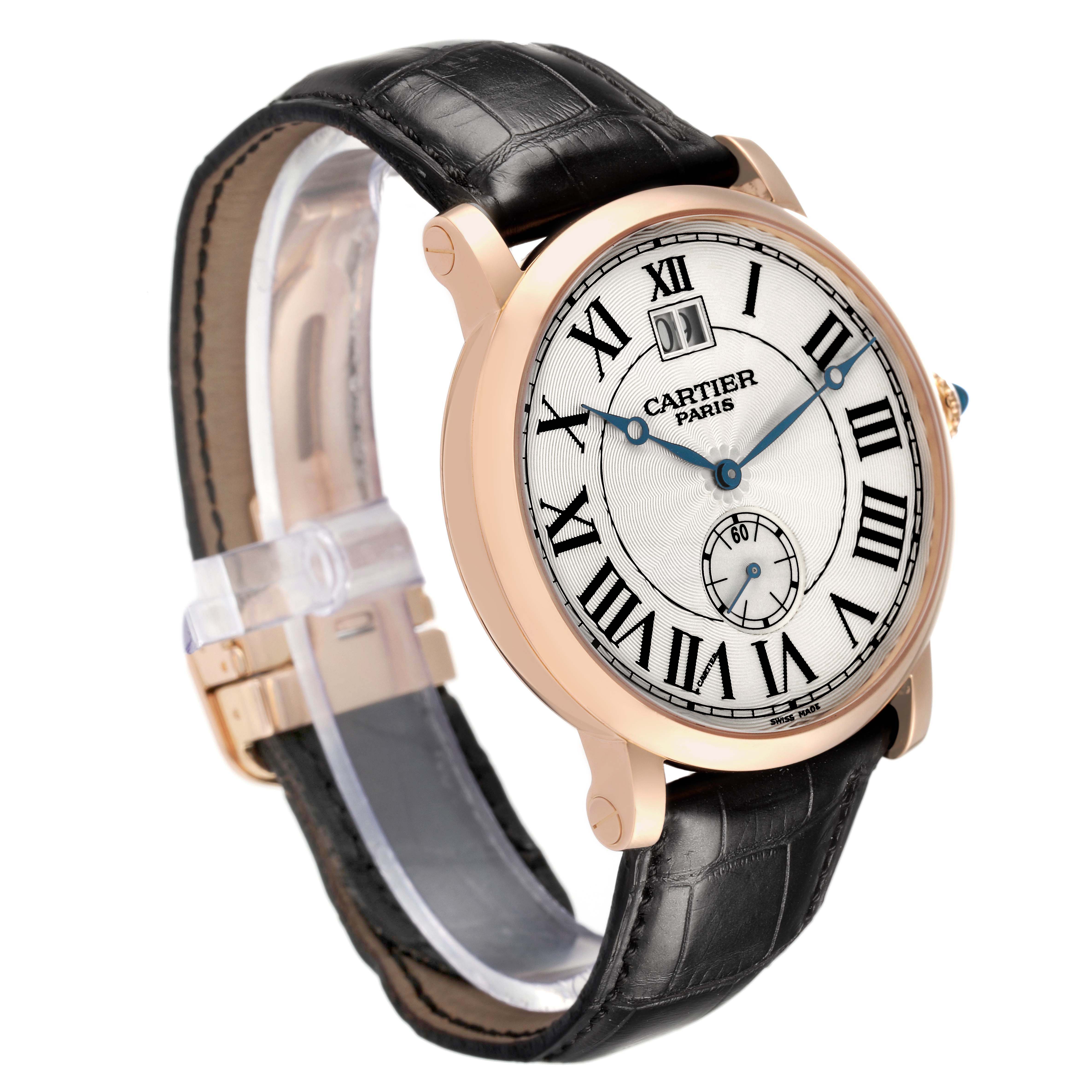 The Rotonde de Cartier watch is shown at a three-quarter angle, displaying its face, Roman numerals, hands, and leather strap.
