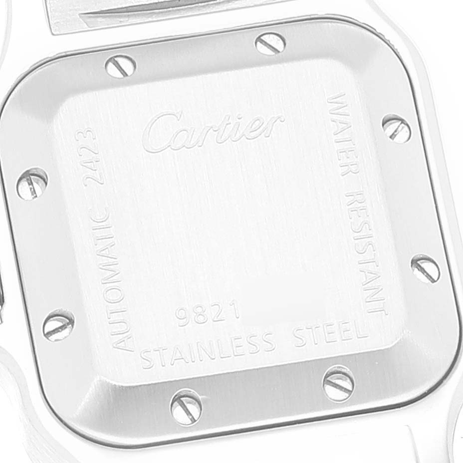 The image shows the back case of a Santos model watch by Cartier, featuring the brand's name and specifications.