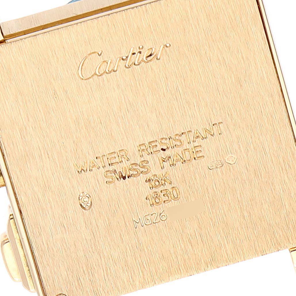 This image shows the back of the Tank Francaise model by Cartier, displaying inscriptions and engravings.