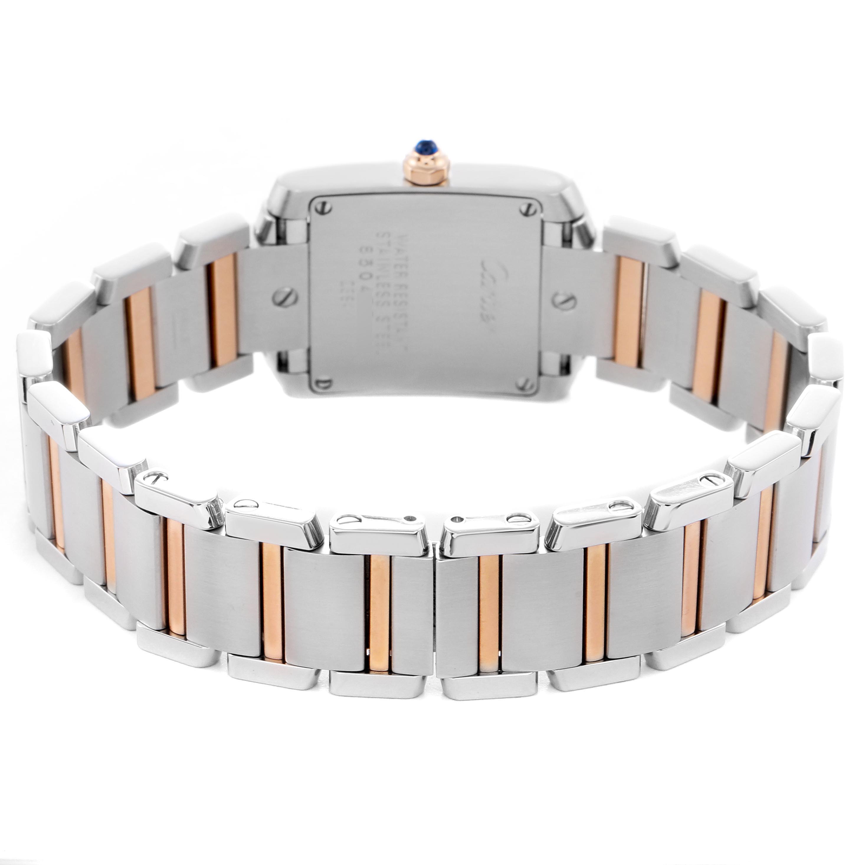 The Cartier Tank Française watch is shown from the back, highlighting the two-tone metal bracelet and case back with its screws.