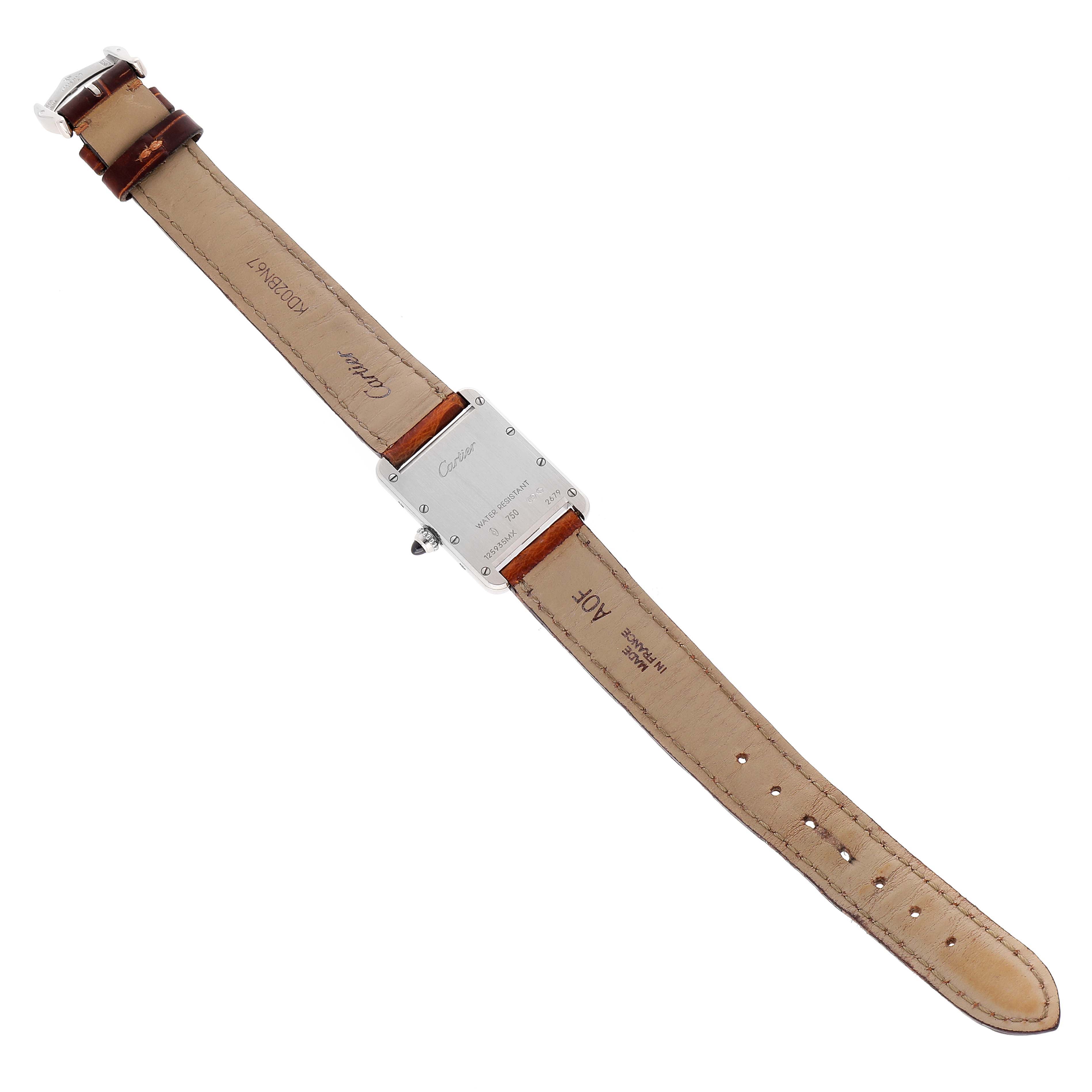 The image shows the back view of a Tank Louis watch by Cartier, highlighting the strap and case back.