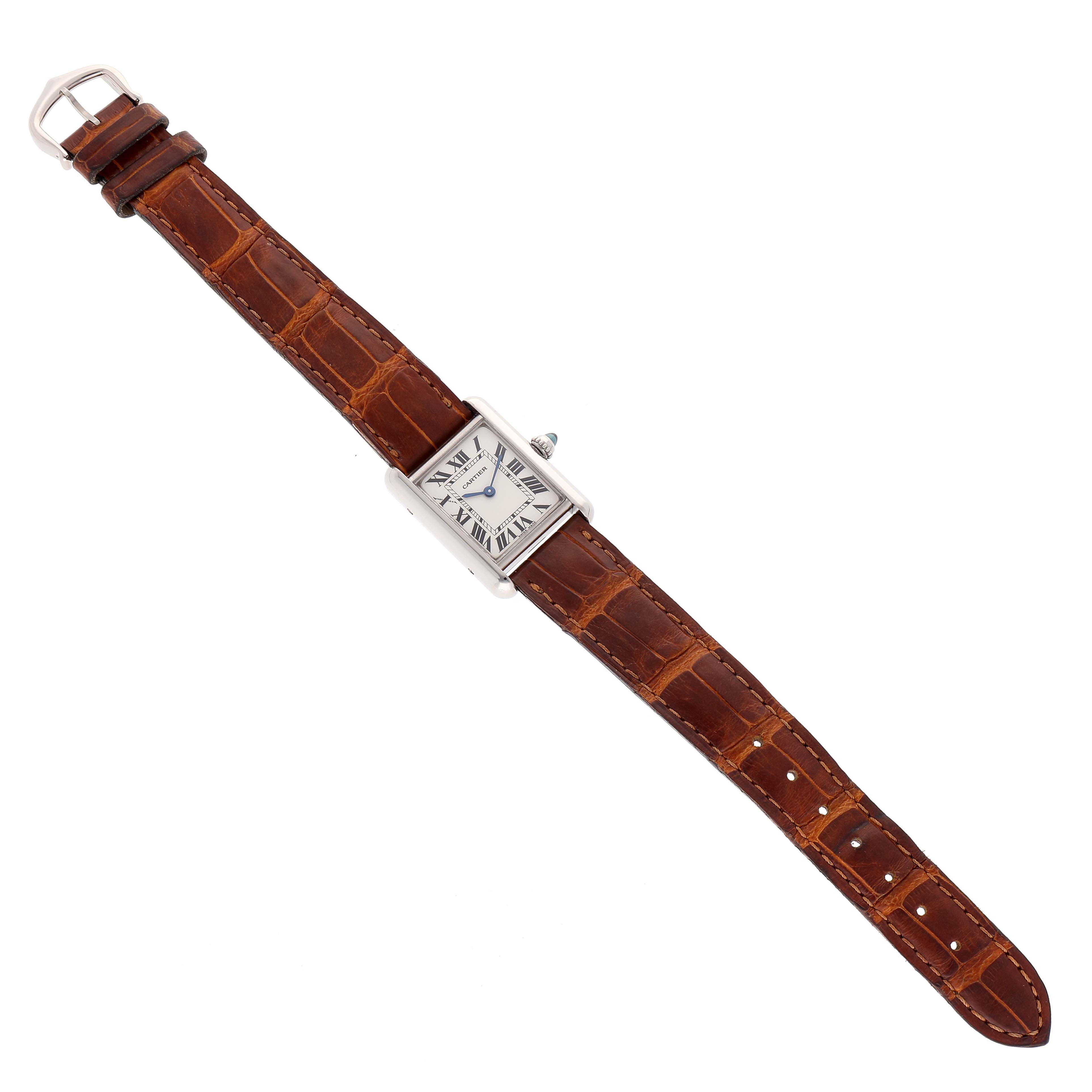 The Cartier Tank Louis W1541056 Women
s White Gold Silver Dial W1541056 Women
s White Gold Silver Dial watch is shown from a top-down angle, displaying the full face and brown leather strap.