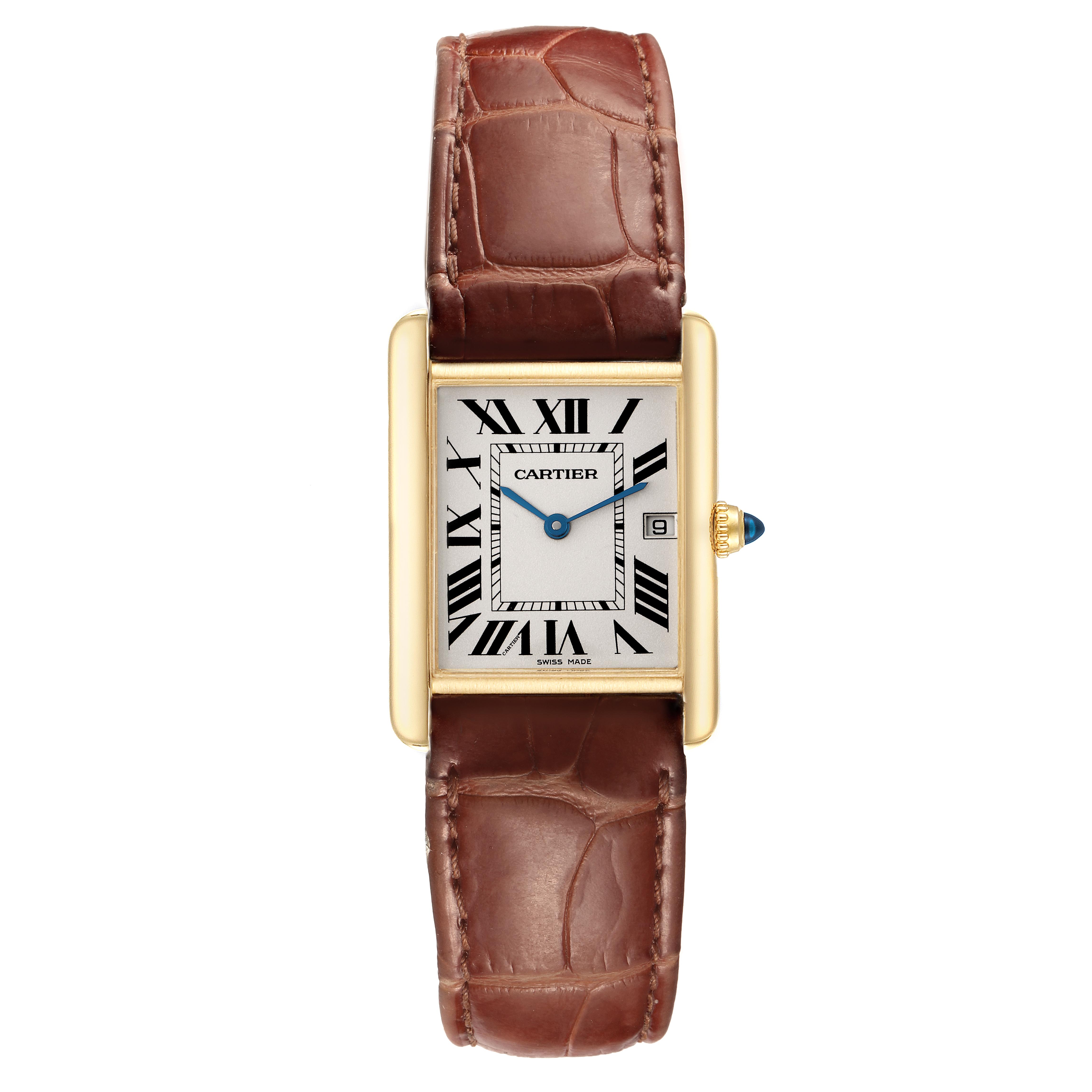 The Cartier Tank Louis W1529756 Men
s Yellow Gold Silver Dial W1529756 Men
s Yellow Gold Silver Dial watch is shown from a top-down angle, highlighting the face, brown leather strap, and gold casing.