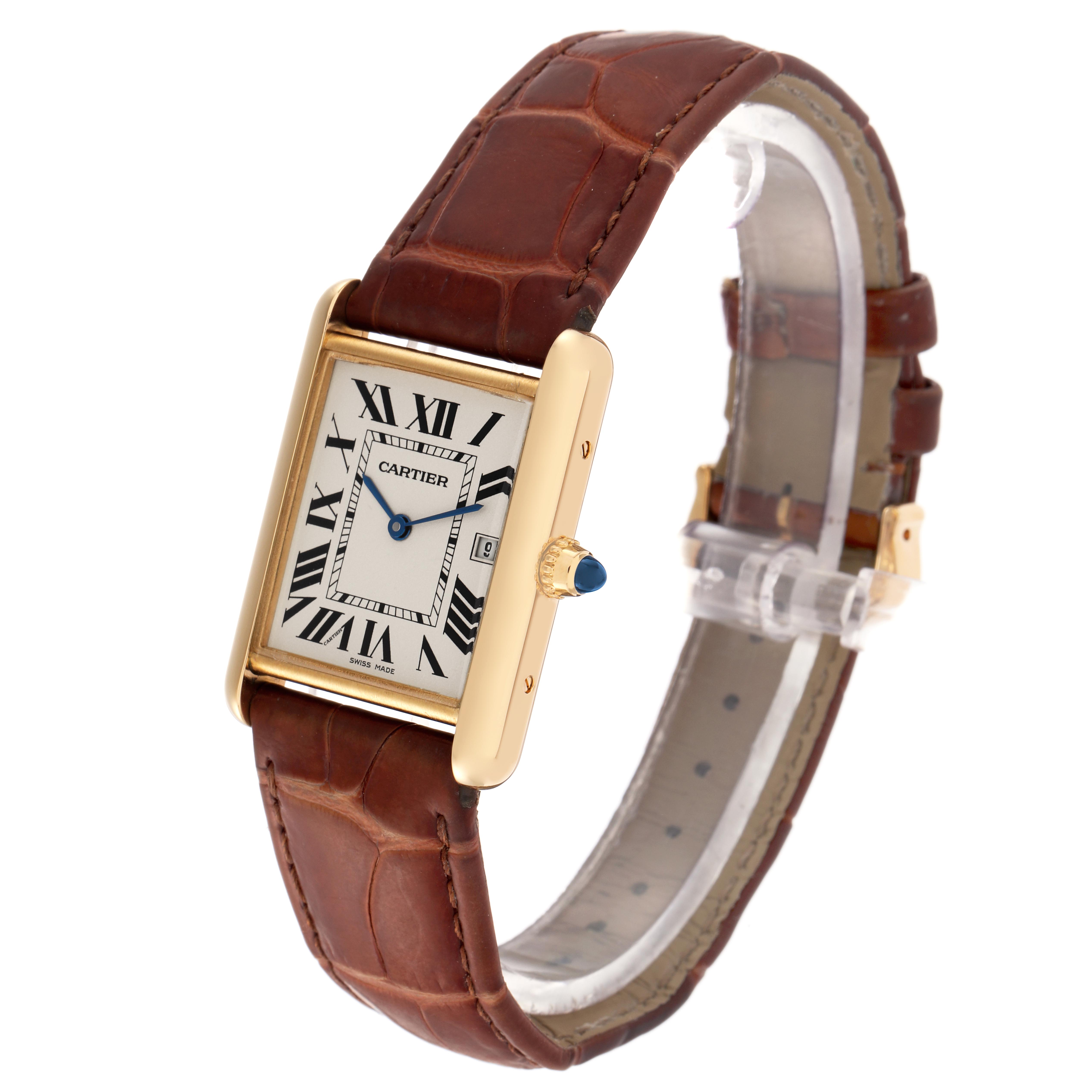 The Cartier Tank Louis W1529756 Men
s Yellow Gold Silver Dial W1529756 Men
s Yellow Gold Silver Dial watch is displayed at an angle showing its dial, Roman numerals, blue hands, crown, and brown leather strap.