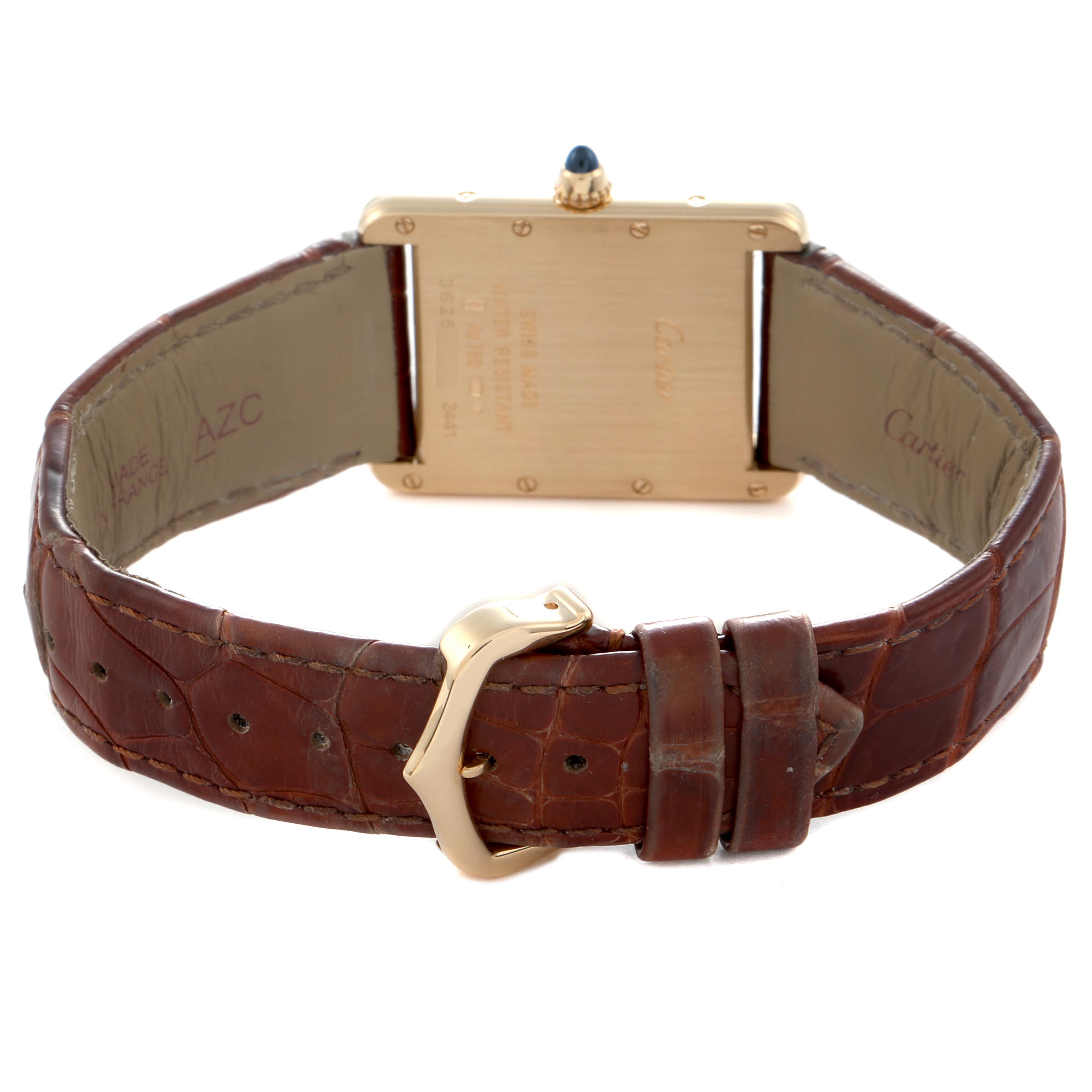 The image shows the back of a Cartier Tank Louis W1529756 Men
s Yellow Gold Silver Dial W1529756 Men
s Yellow Gold Silver Dial watch with the strap and buckle visible.