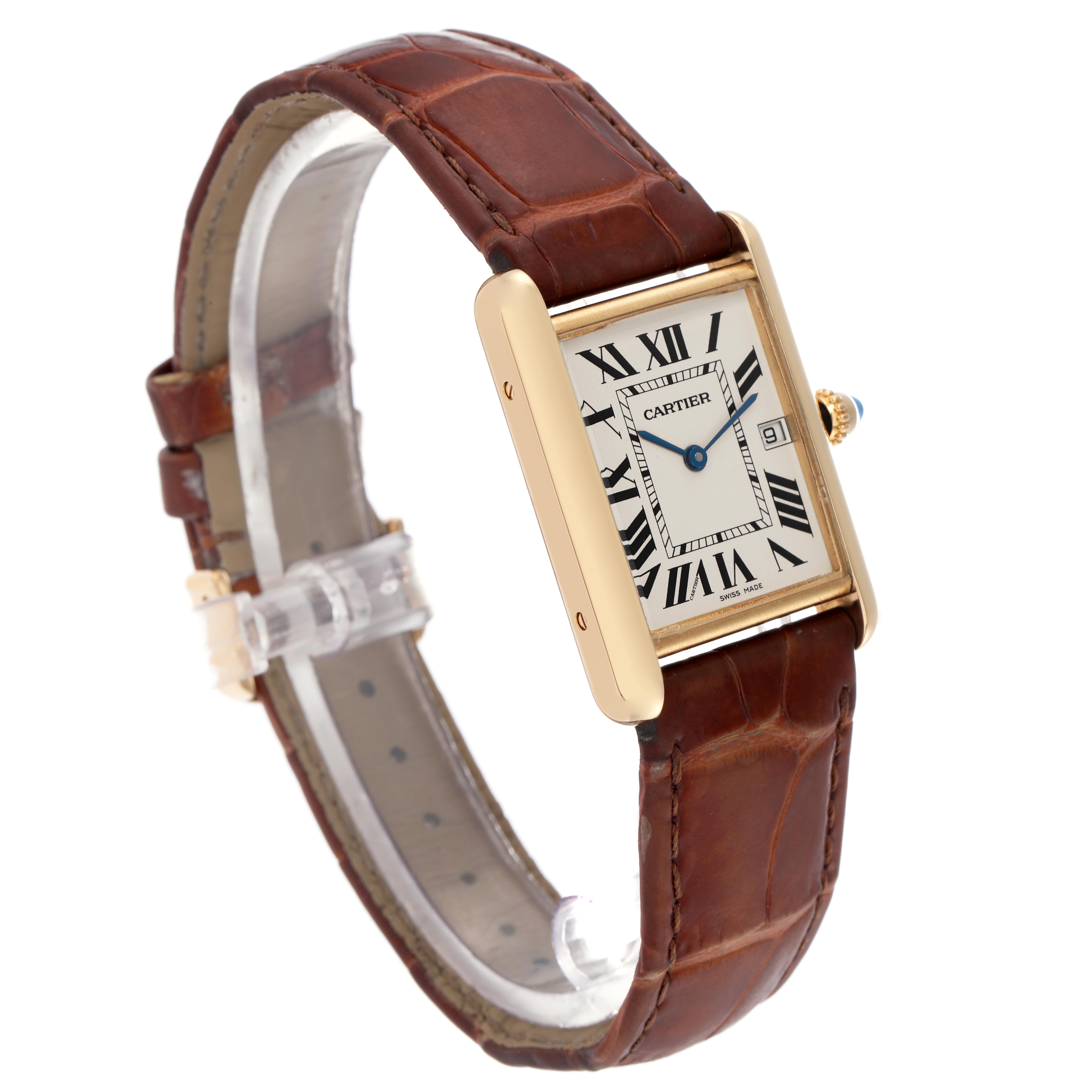 The Cartier Tank Louis W1529756 Men
s Yellow Gold Silver Dial W1529756 Men
s Yellow Gold Silver Dial watch is shown at a slight angle, displaying the face, crown, and brown leather strap.
