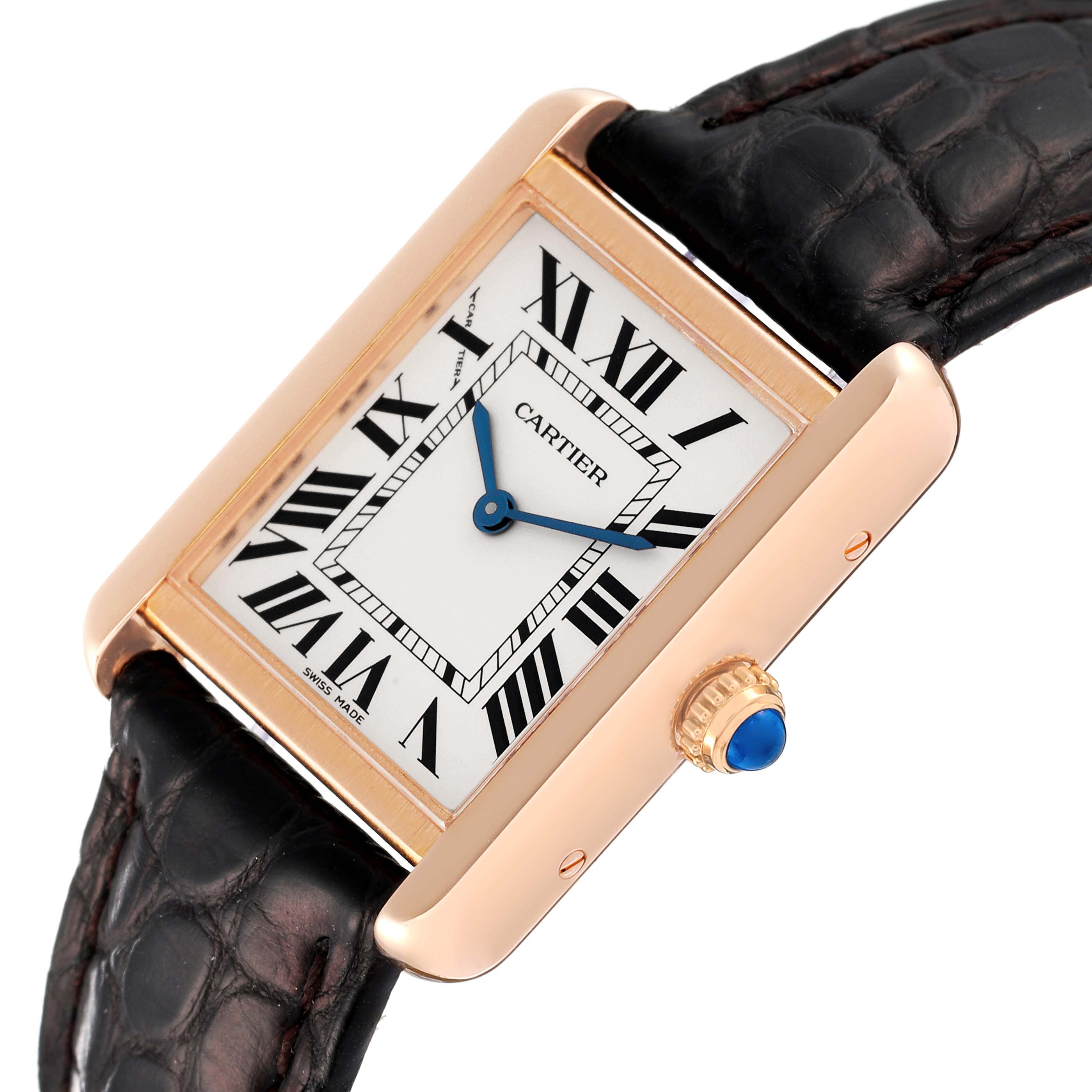 The image depicts a Cartier Tank Solo W5200024 Women's Rose Gold Silver Dial W5200024 Women's Rose Gold Silver Dial watch from an oblique angle showcasing its face, crown, and part of the leather strap.