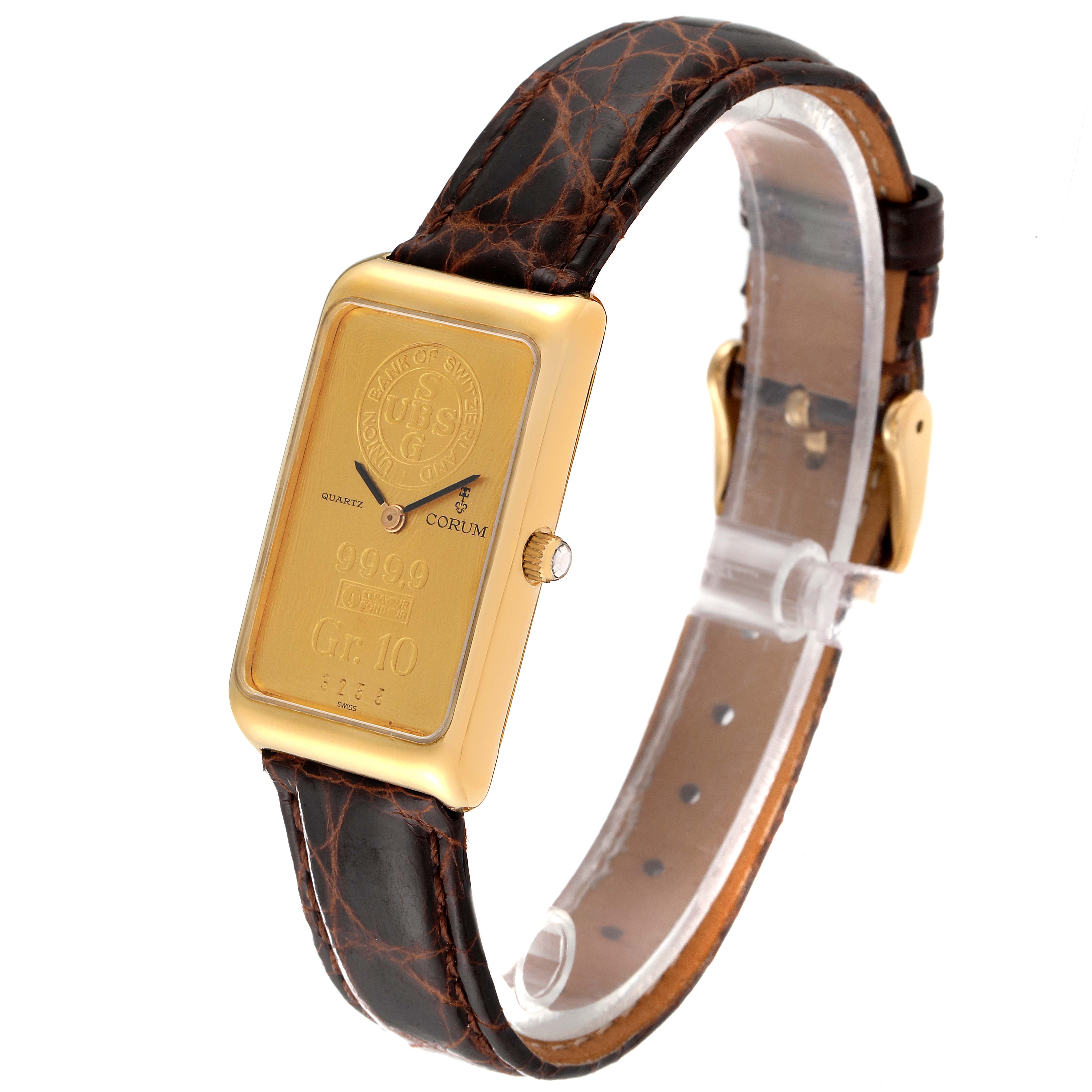 The image shows a side angle of the Corum Women's Yellow Gold Champagne Dial Women's Yellow Gold Champagne Dial 18K Yellow Gold 10 Gram Ingot 999.9 Ladies Watch, highlighting the face and strap.
