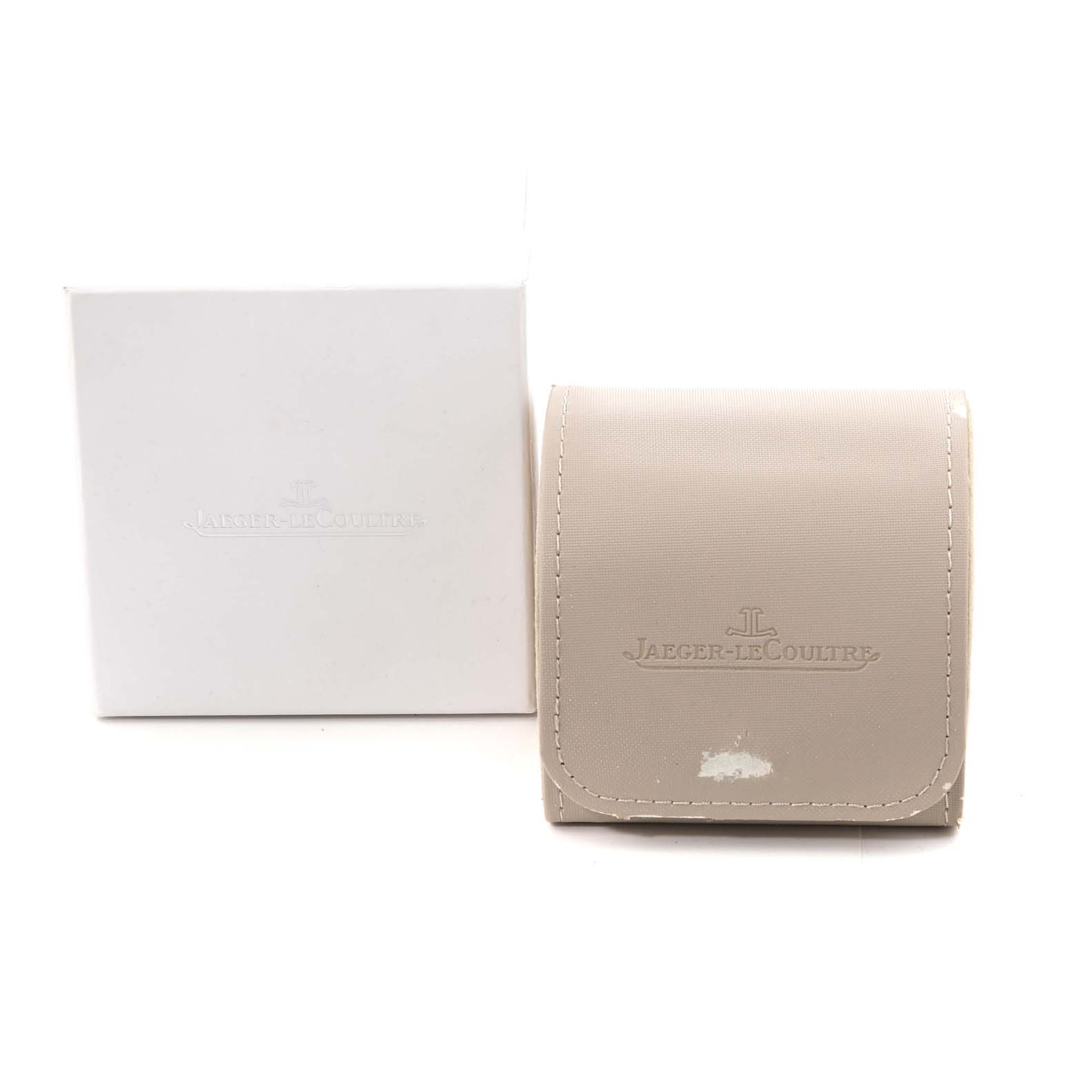 The image shows a white box and a beige pouch with the Jaeger-LeCoultre branding, likely accessories for the Master model.