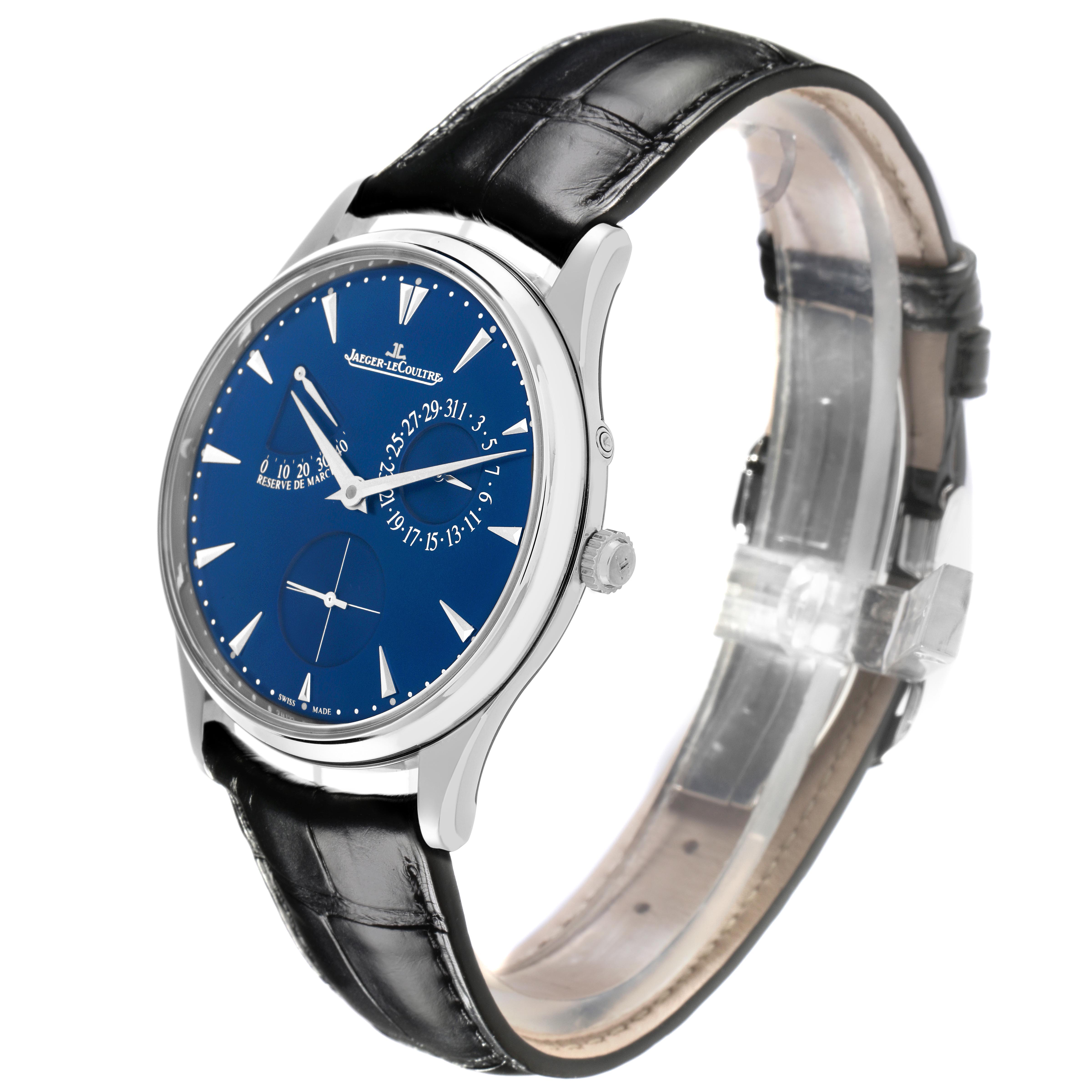 The Jaeger-LeCoultre Master watch is shown at a three-quarter angle, highlighting its blue dial, silver case, and black leather strap.