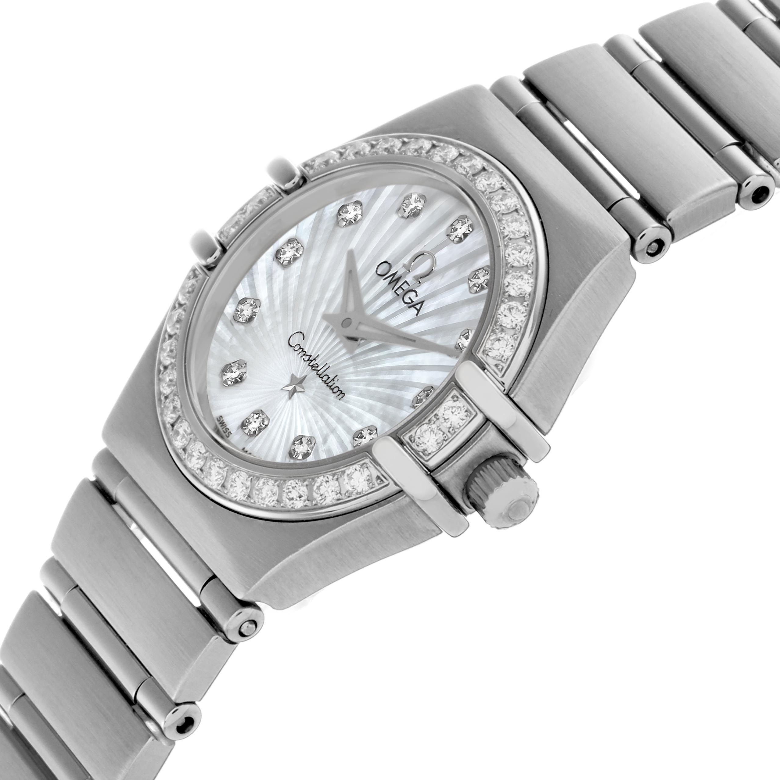 The Omega 111.15.23.60.55.001 Women
s Stainless Steel Mother of Pearl Dial 111.15.23.60.55.001 Women
s Stainless Steel Mother of Pearl Dial Constellation 1475.71.00 watch is shown from an angled side view, highlighting its diamond bezel, mother-of-pearl dial, and bracelet.
