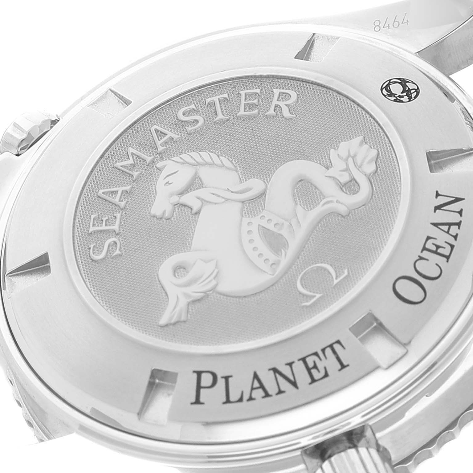 The image shows the back case of an Omega Seamaster Planet Ocean watch, highlighting its engraved design and model name.