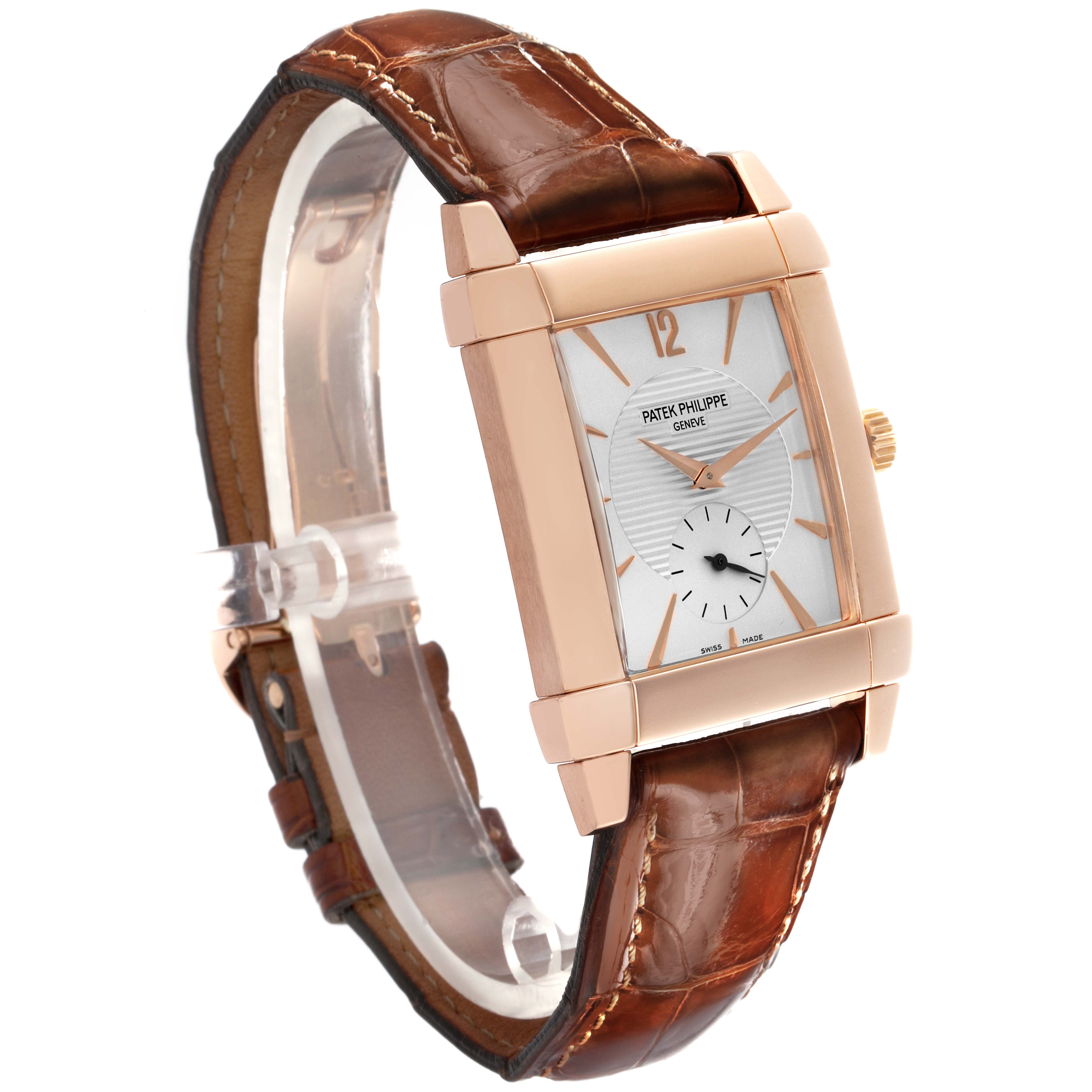 The Patek Philippe Gondolo 5111R-001 Men's Rose Gold Silver Dial 5111R-001 Men's Rose Gold Silver Dial watch is shown at an angled side view, highlighting its rectangular face, rose gold case, and brown leather strap.