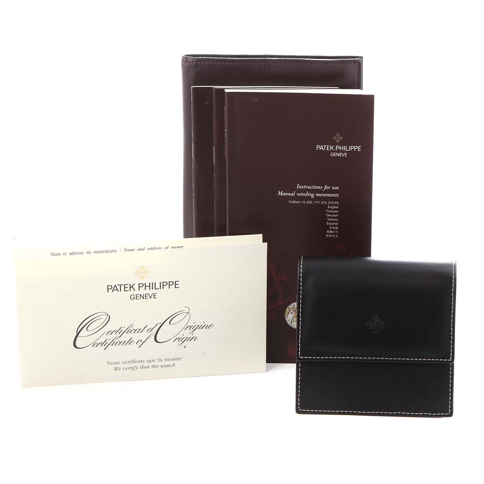 The image shows a Patek Philippe Gondolo 5111R-001 Men's Rose Gold Silver Dial 5111R-001 Men's Rose Gold Silver Dial watch's accessories, including a certificate, manuals, and a black leather case, from a front angle.