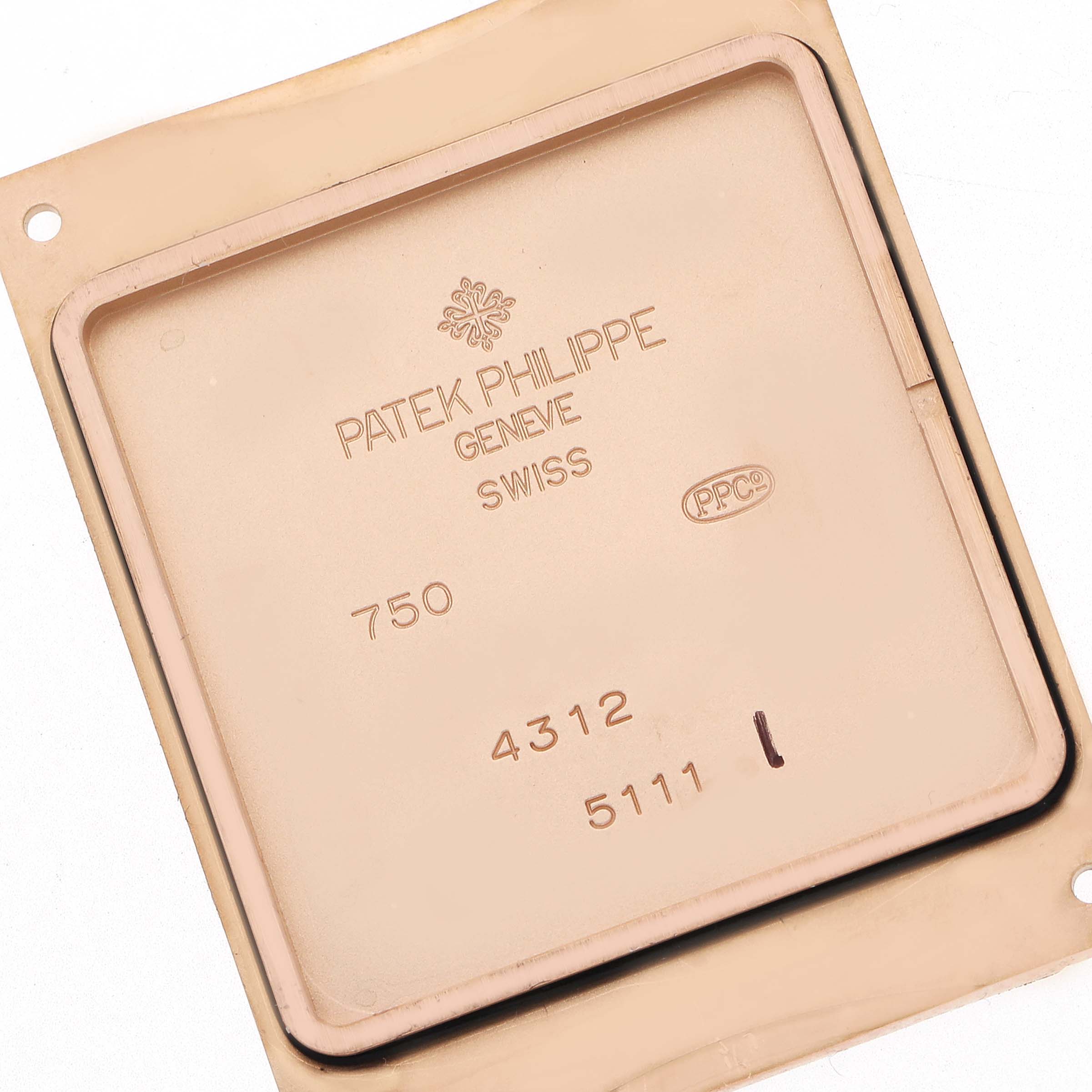 The image shows the back casing of a Patek Philippe Gondolo 5111R-001 Men's Rose Gold Silver Dial 5111R-001 Men's Rose Gold Silver Dial watch, highlighting engravings and markings.