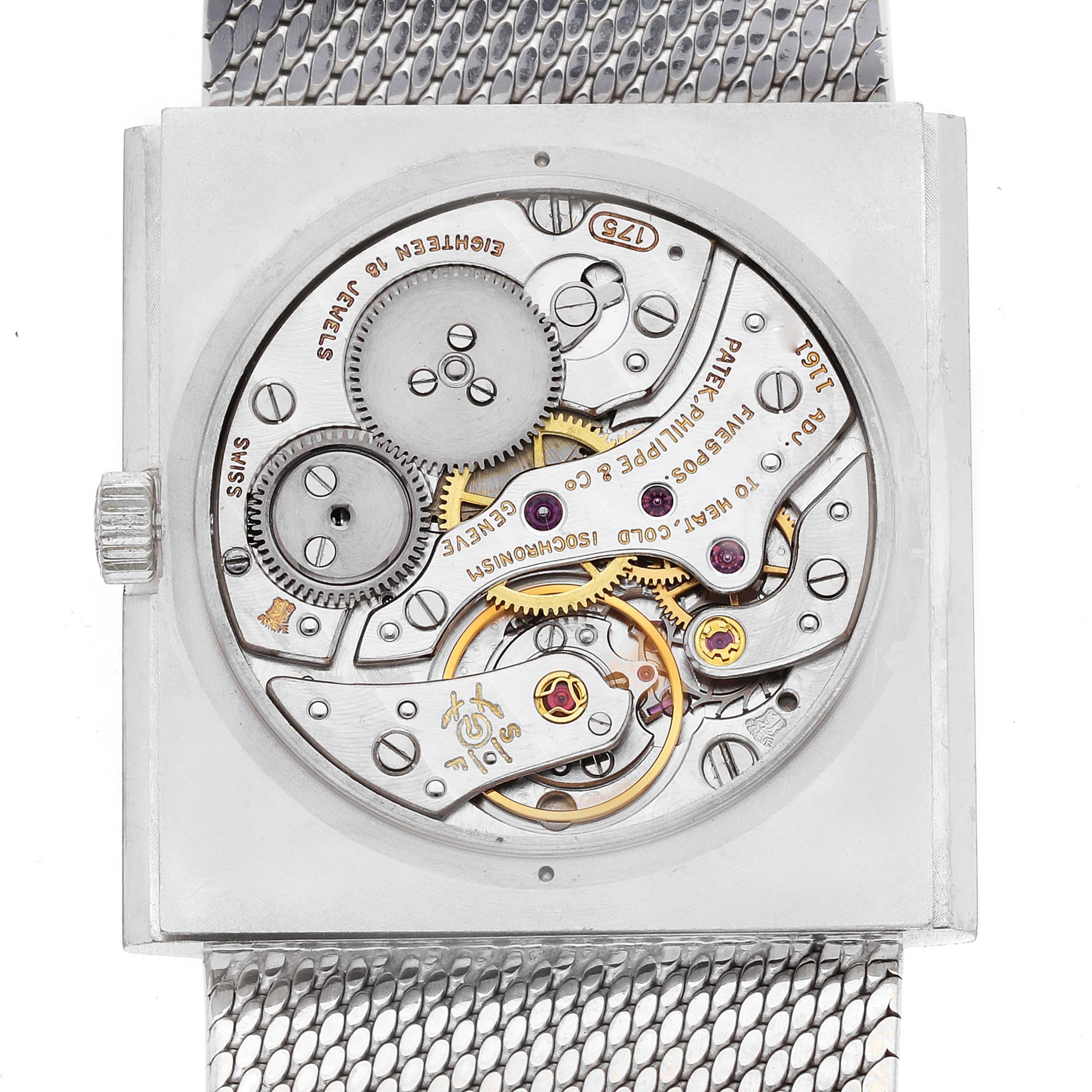 The image shows the back view of a Patek Philippe Vintage 3491/3 Women
s White Gold Silver Dial 3491/3 Women
s White Gold Silver Dial watch, highlighting its intricate movement and mechanical components.