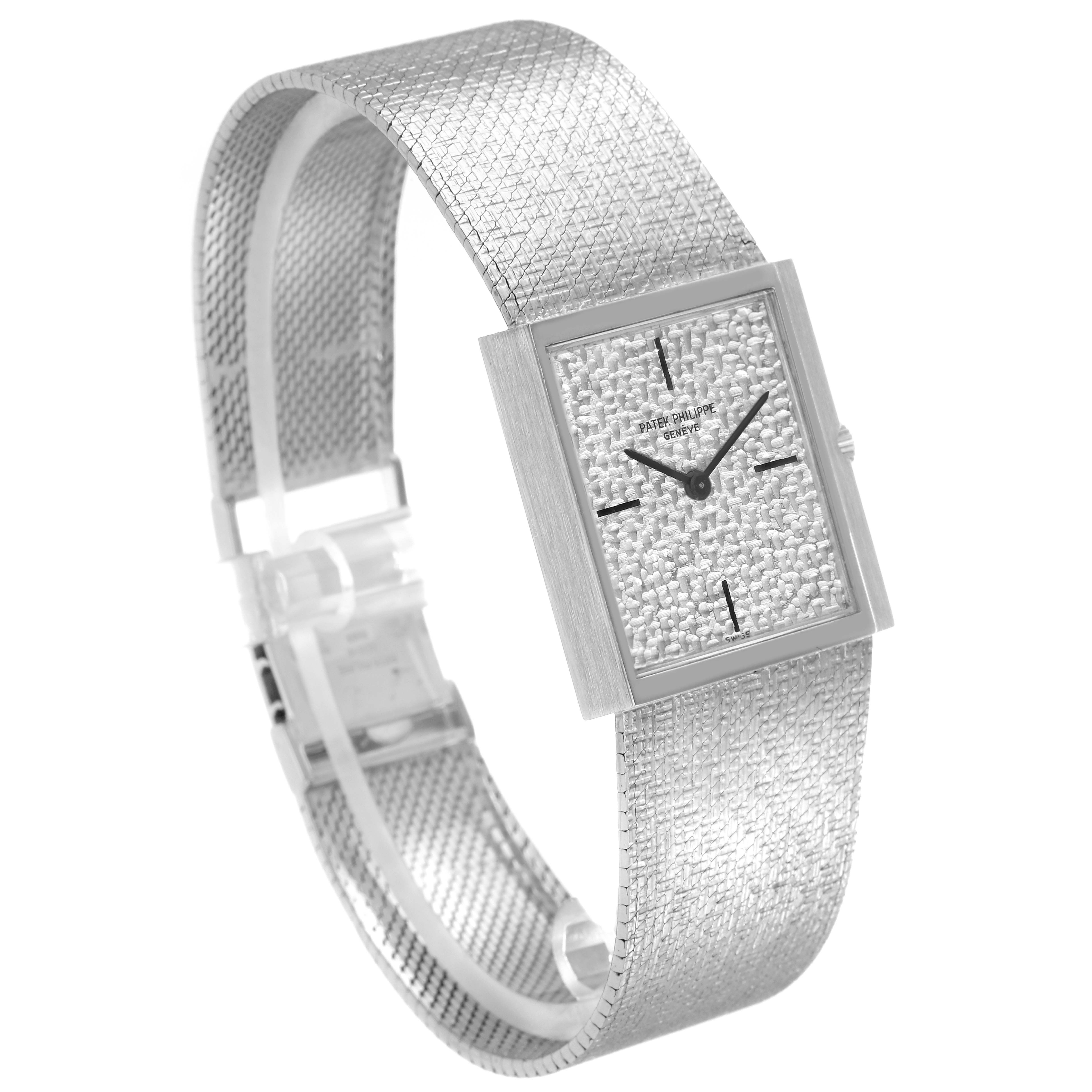 The Vintage Patek Philippe watch is shown from a front angle, highlighting its textured dial and mesh strap.