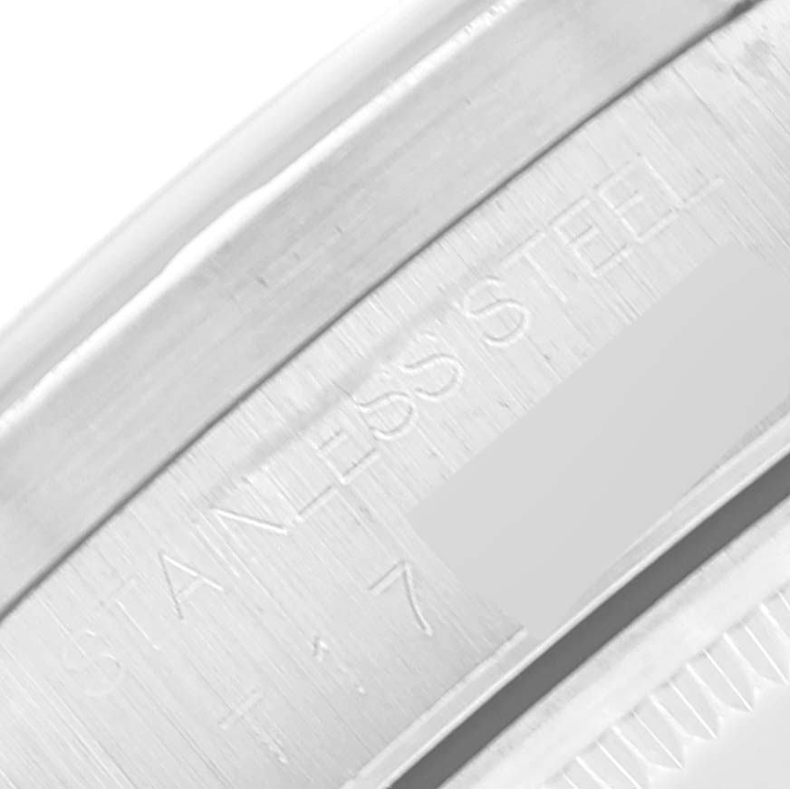 The image shows a close-up of the case and bezel of a Rolex Air-King 14010 Men's Stainless Steel Grey Dial 14010 Men's Stainless Steel Grey Dial watch, highlighting the "STAINLESS STEEL" engraving.