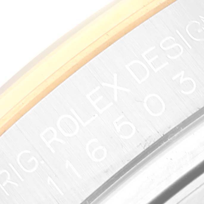 The image shows a close-up of the engravings on the caseback side of a Rolex Daytona 116503 Men
s Steel and Gold (two tone) Black Dial 116503 Men
s Steel and Gold (two tone) Black Dial watch.