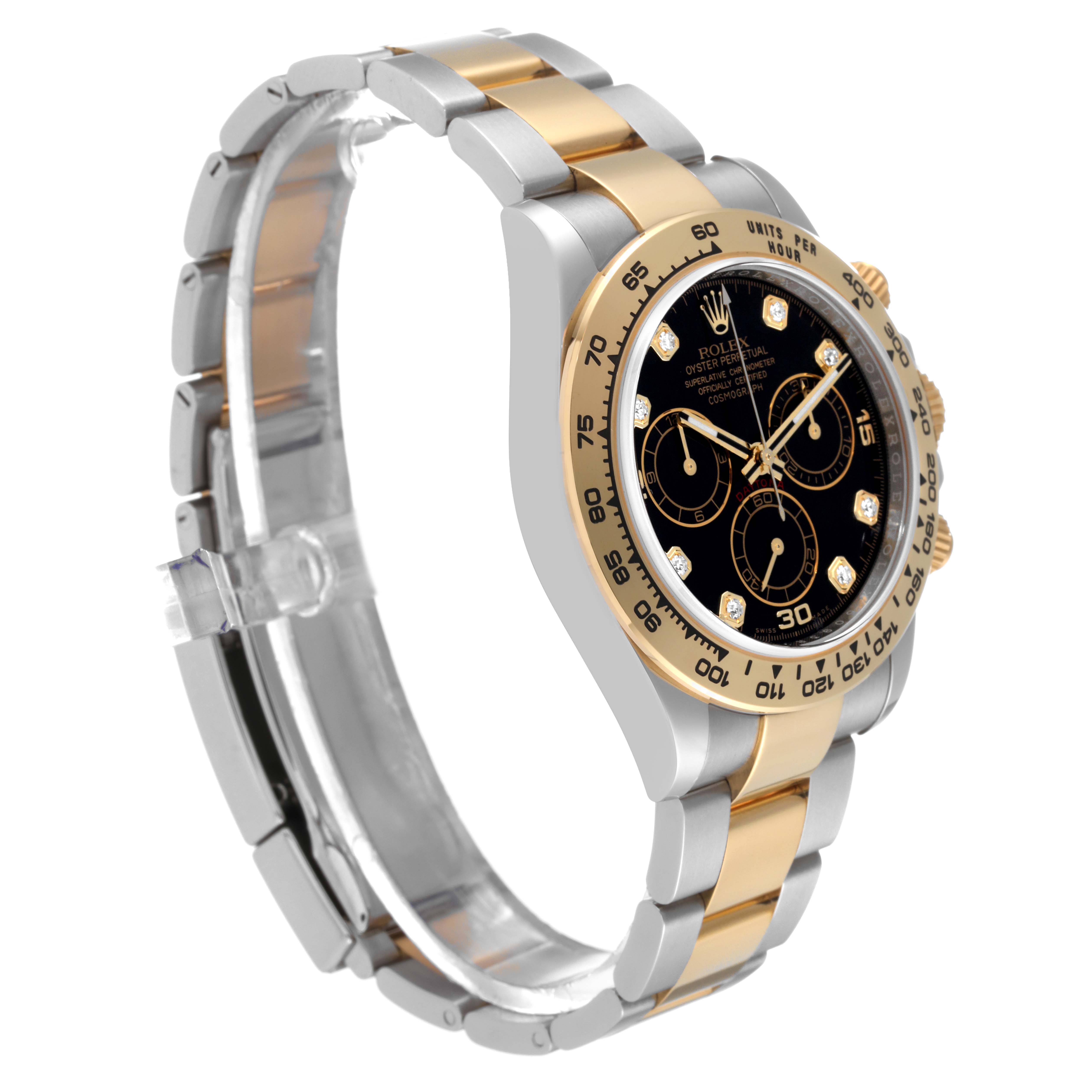 The image shows a Rolex Daytona 116503 Men
s Steel and Gold (two tone) Black Dial 116503 Men
s Steel and Gold (two tone) Black Dial watch at a three-quarter angle, highlighting its two-tone bracelet, dial, and bezel.