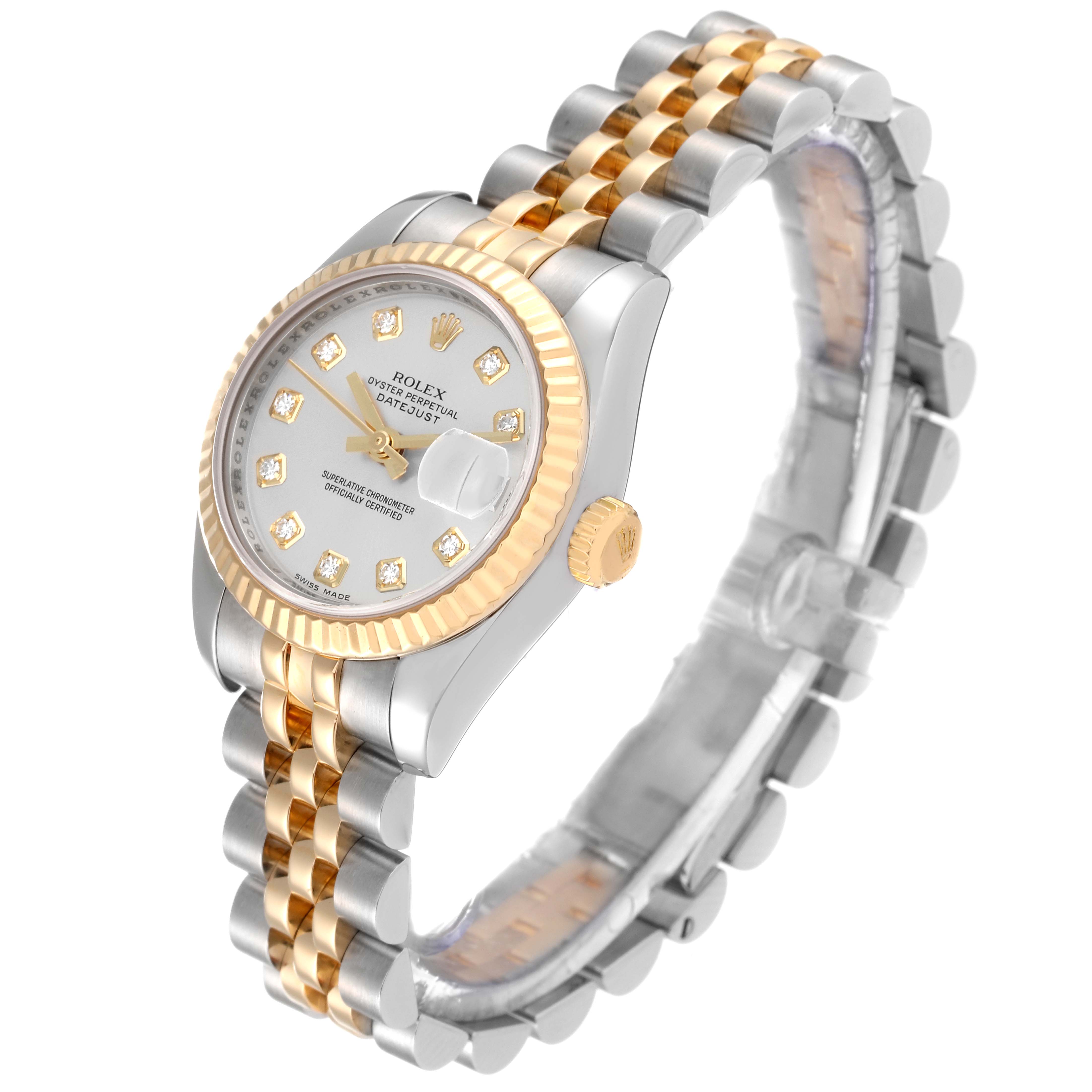 The Rolex Datejust 179173 Women's Steel and Gold (two tone) Silver Dial 179173 Women's Steel and Gold (two tone) Silver Dial watch is shown at a tilted angle, highlighting its face, bezel, crown, and two-tone bracelet.