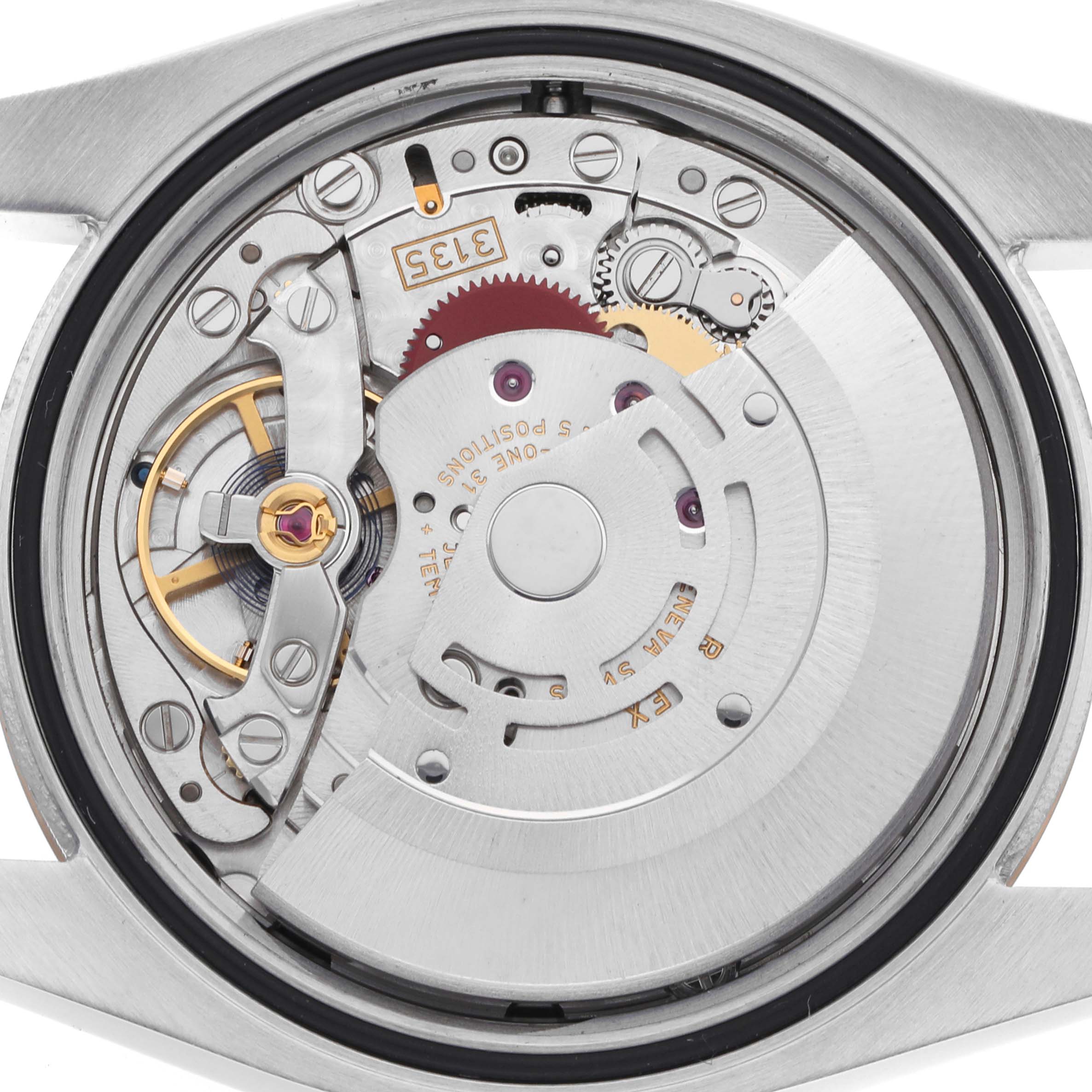 The image shows the Rolex Datejust 116231 Men
s Steel and Gold (two tone) Black Dial 116231 Men
s Steel and Gold (two tone) Black Dial watch
s movement from the back, highlighting gear components and the rotor.