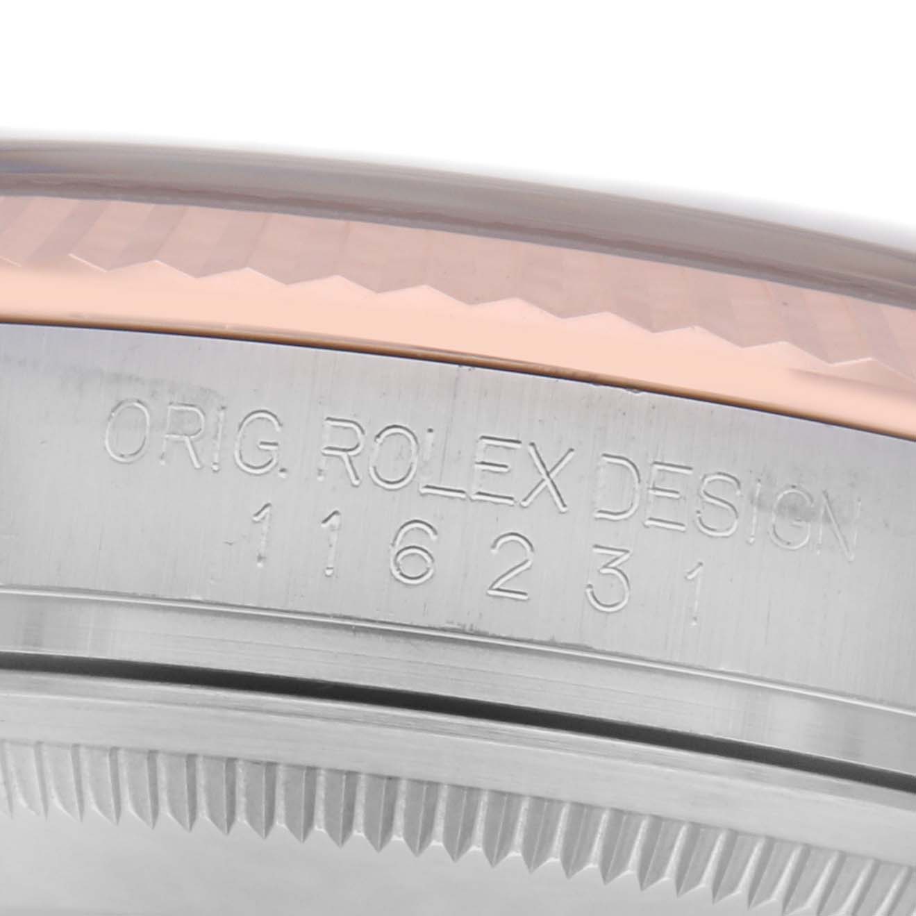 The image shows a close-up of the side edge of a Rolex Datejust 116231 Men
s Steel and Gold (two tone) Black Dial 116231 Men
s Steel and Gold (two tone) Black Dial watch, highlighting the case
s engraved design number.