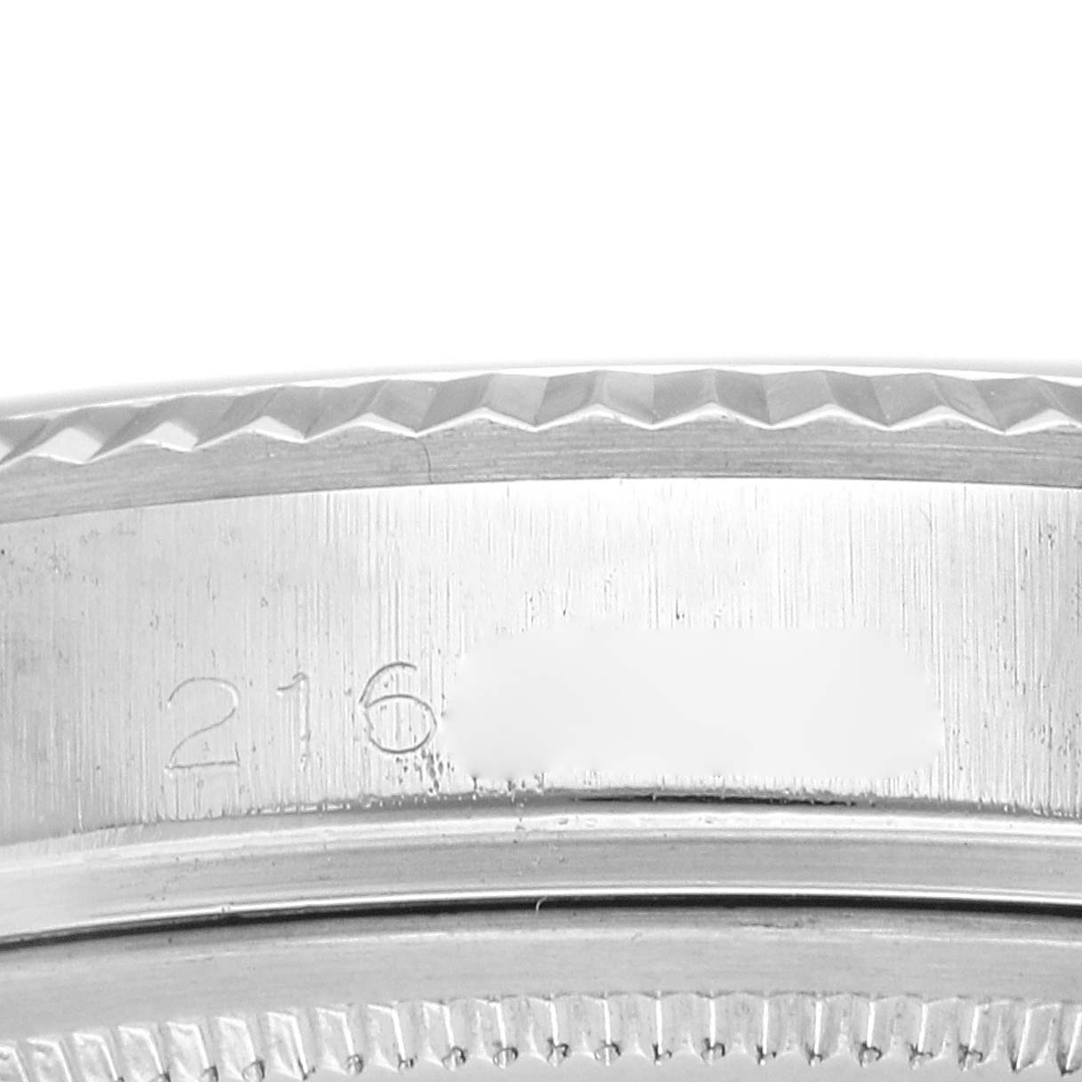 The image shows a close-up of the bezel and serial number engravings on a Rolex Datejust 1601 Men
s Stainless Steel Silver Dial 1601 Men
s Stainless Steel Silver Dial watch.