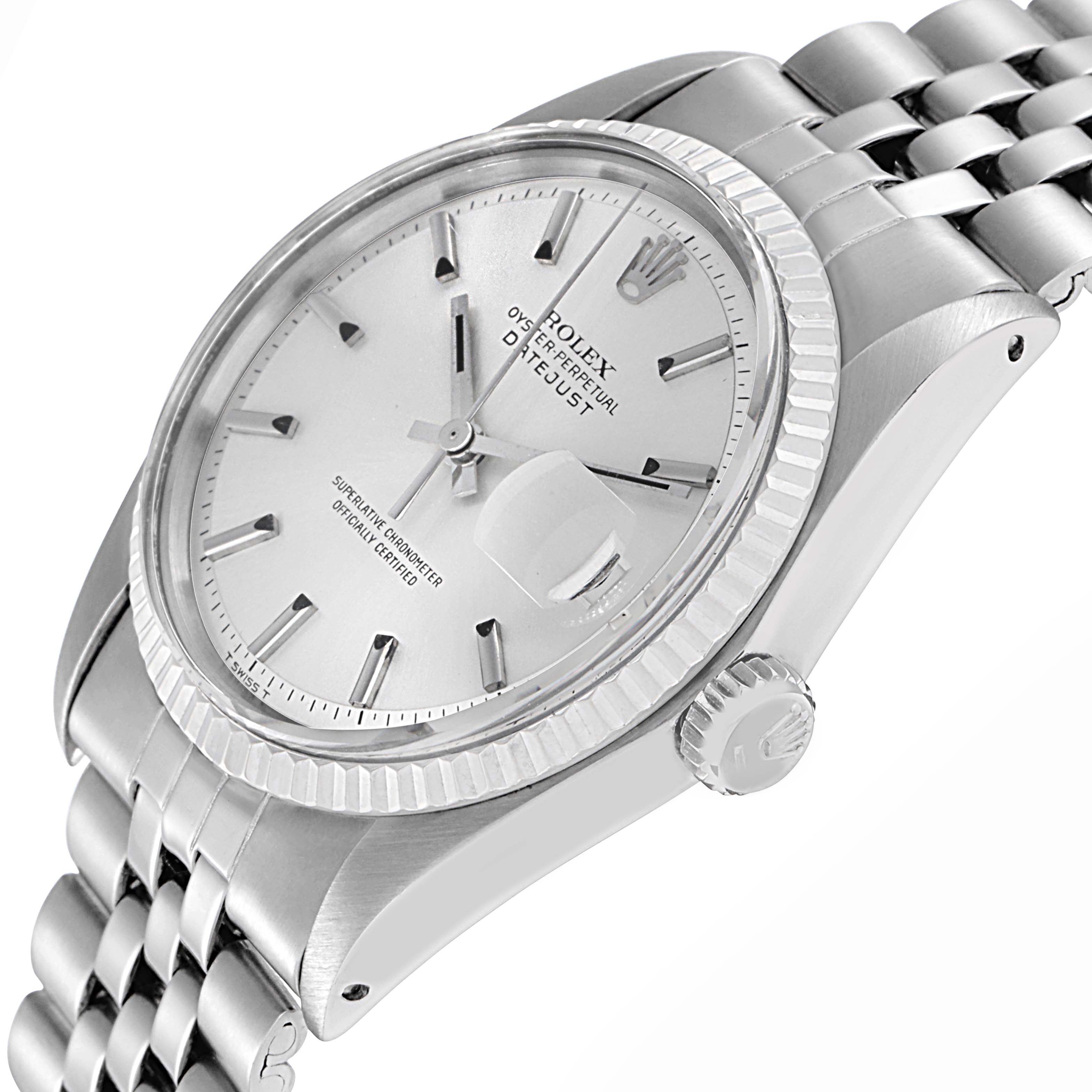 The Rolex Datejust 1601 Men
s Stainless Steel Silver Dial 1601 Men
s Stainless Steel Silver Dial watch is shown at an angled side view, highlighting the dial, fluted bezel, crown, and bracelet.