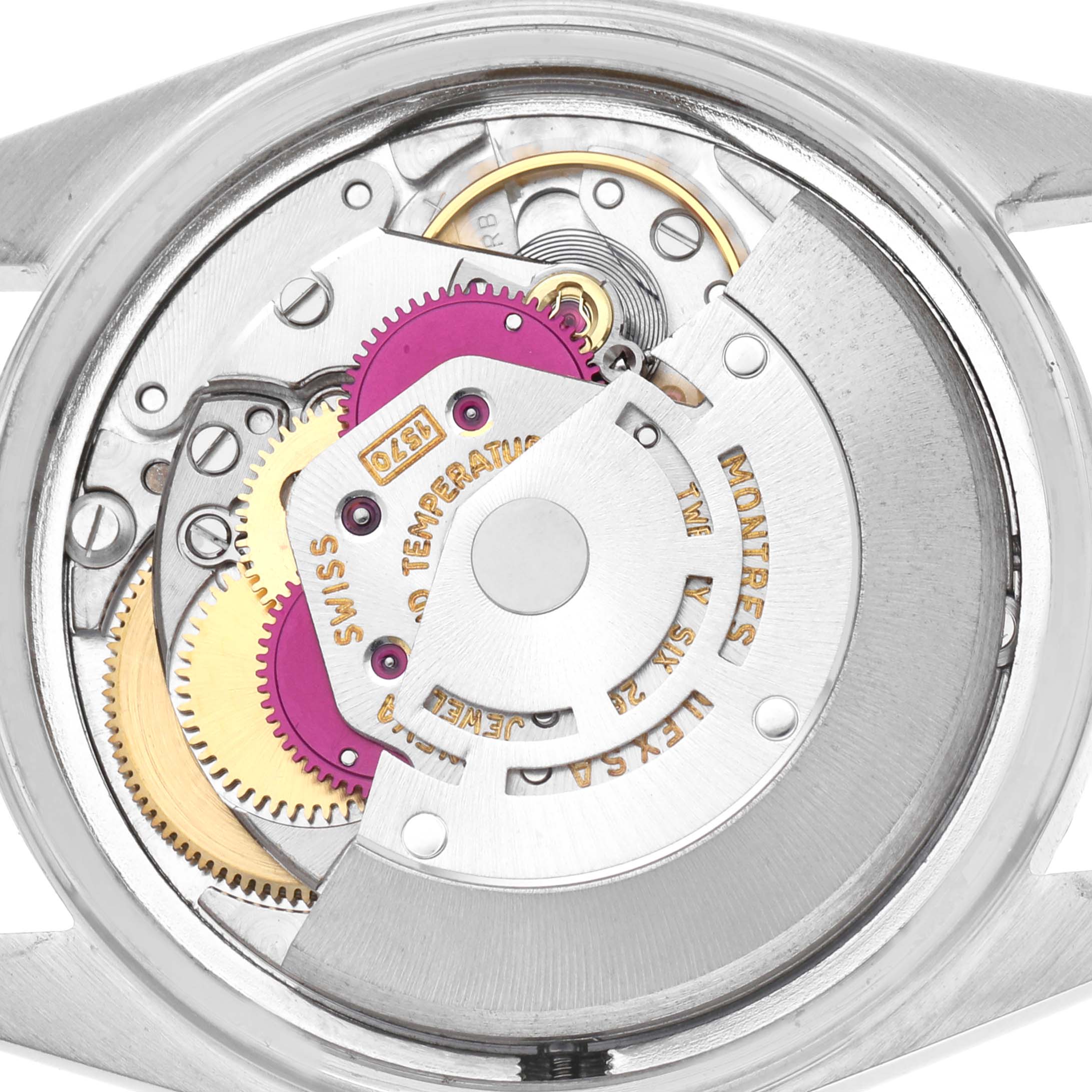 The image shows a close-up view of the movement mechanism inside a Rolex Datejust 1601 Men
s Stainless Steel Silver Dial 1601 Men
s Stainless Steel Silver Dial watch.