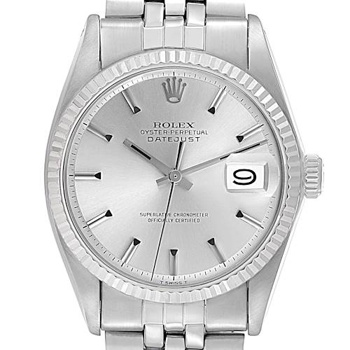 The Rolex Datejust watch is shown from a front angle, displaying its dial, bezel, crown, and bracelet links.