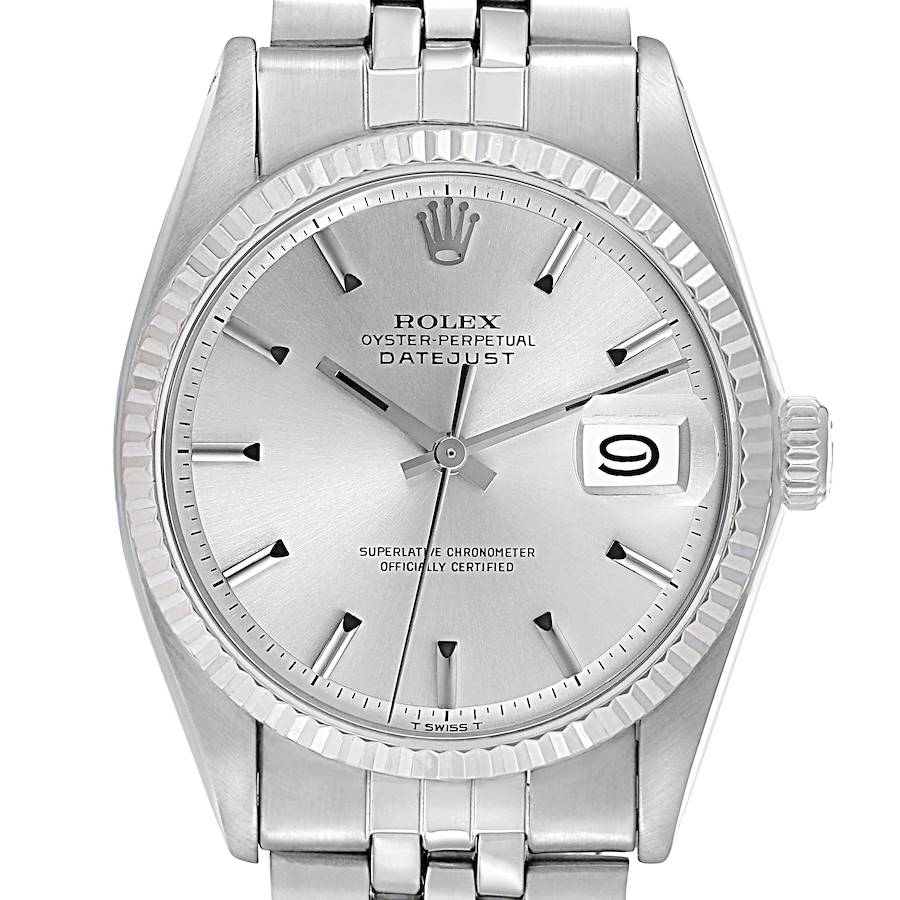 The Rolex Datejust watch is shown from a front angle, highlighting its dial, hands, bezel, and part of the bracelet.