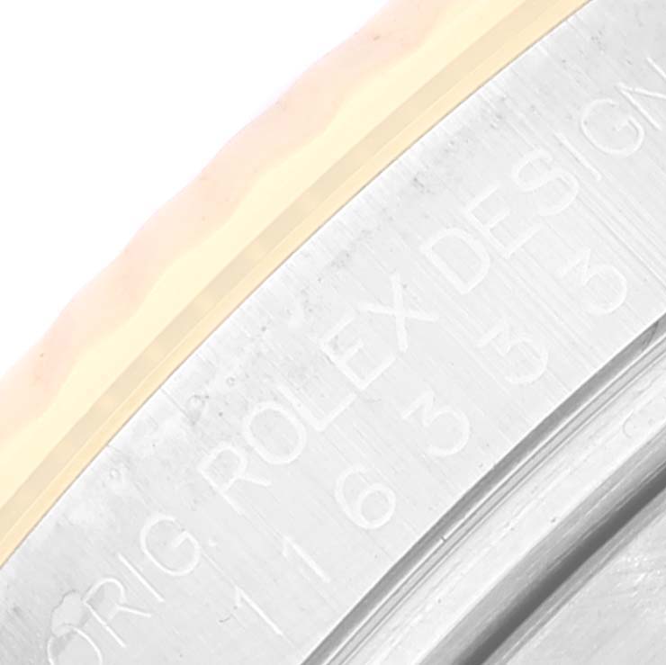 The image shows a close-up of the engraved bezel edge of a Rolex Datejust 41 116333 Men's Steel and Gold (two tone) Grey Dial 116333 Men's Steel and Gold (two tone) Grey Dial model.