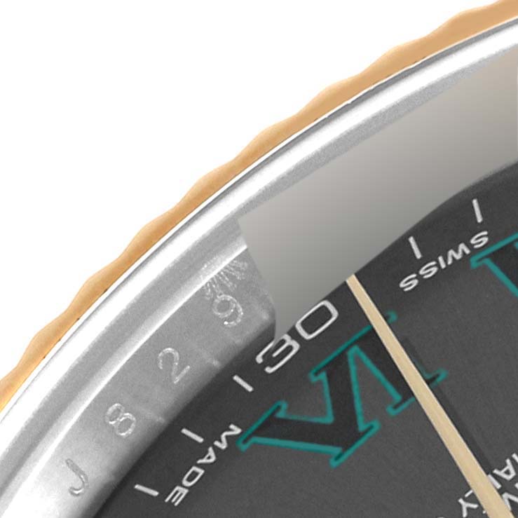 The image shows a close-up of the bezel, edge of the dial, and part of the minute hand of the Rolex Datejust 41 116333 Men's Steel and Gold (two tone) Grey Dial 116333 Men's Steel and Gold (two tone) Grey Dial.