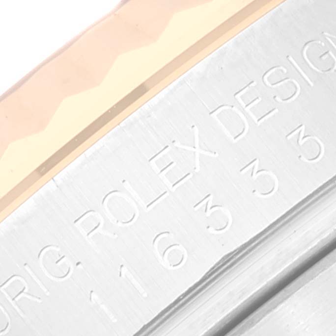 The image shows a close-up of the engraved case side of a Rolex Datejust 41 116333 Men's Steel and Gold (two tone) Grey Dial 116333 Men's Steel and Gold (two tone) Grey Dial watch, featuring the model number and the Rolex logo.