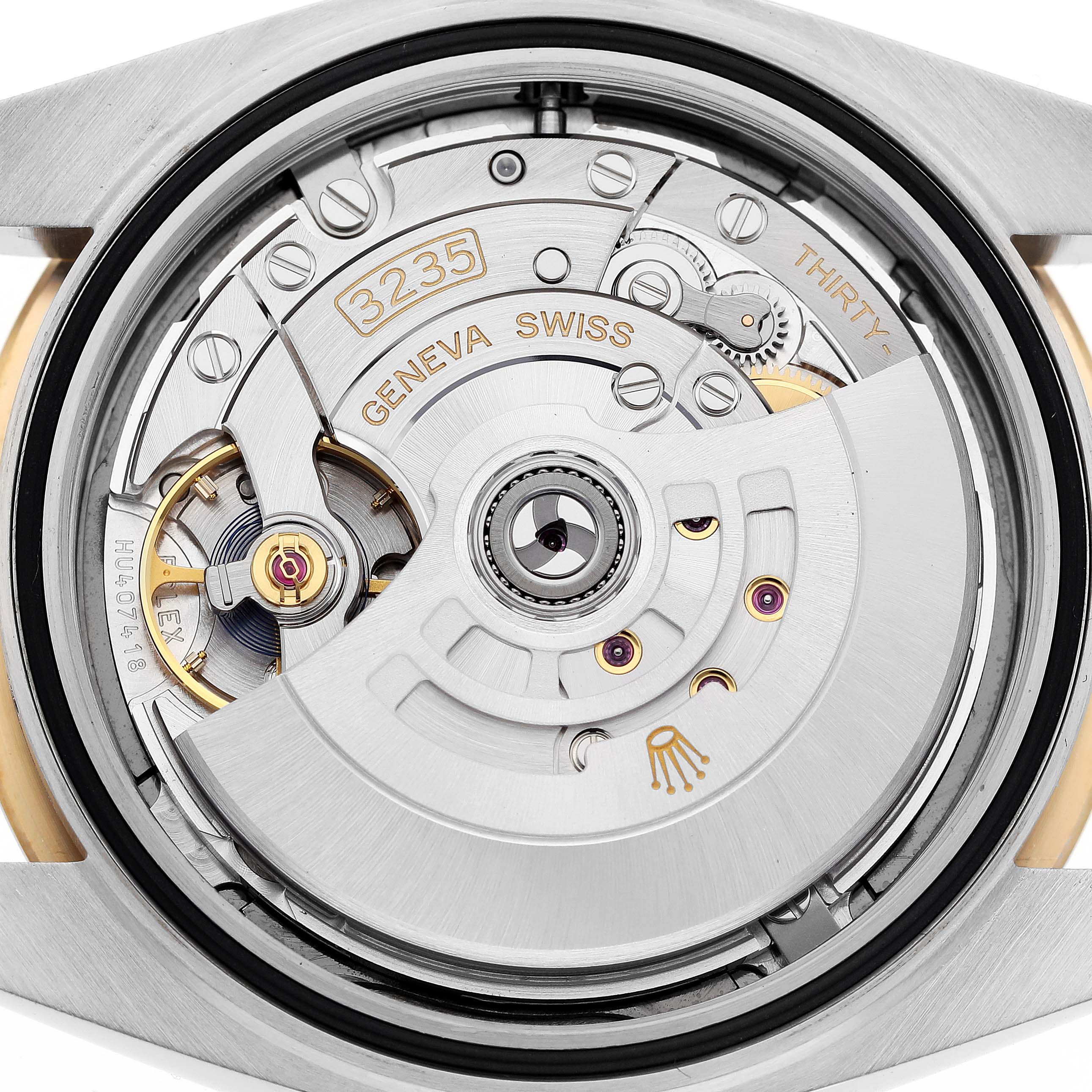 The image shows the movement mechanism of the Rolex Datejust 41 126333 Men
s Steel and Gold (two tone) Grey Dial 126333 Men
s Steel and Gold (two tone) Grey Dial, focusing on its intricate components and engravings.