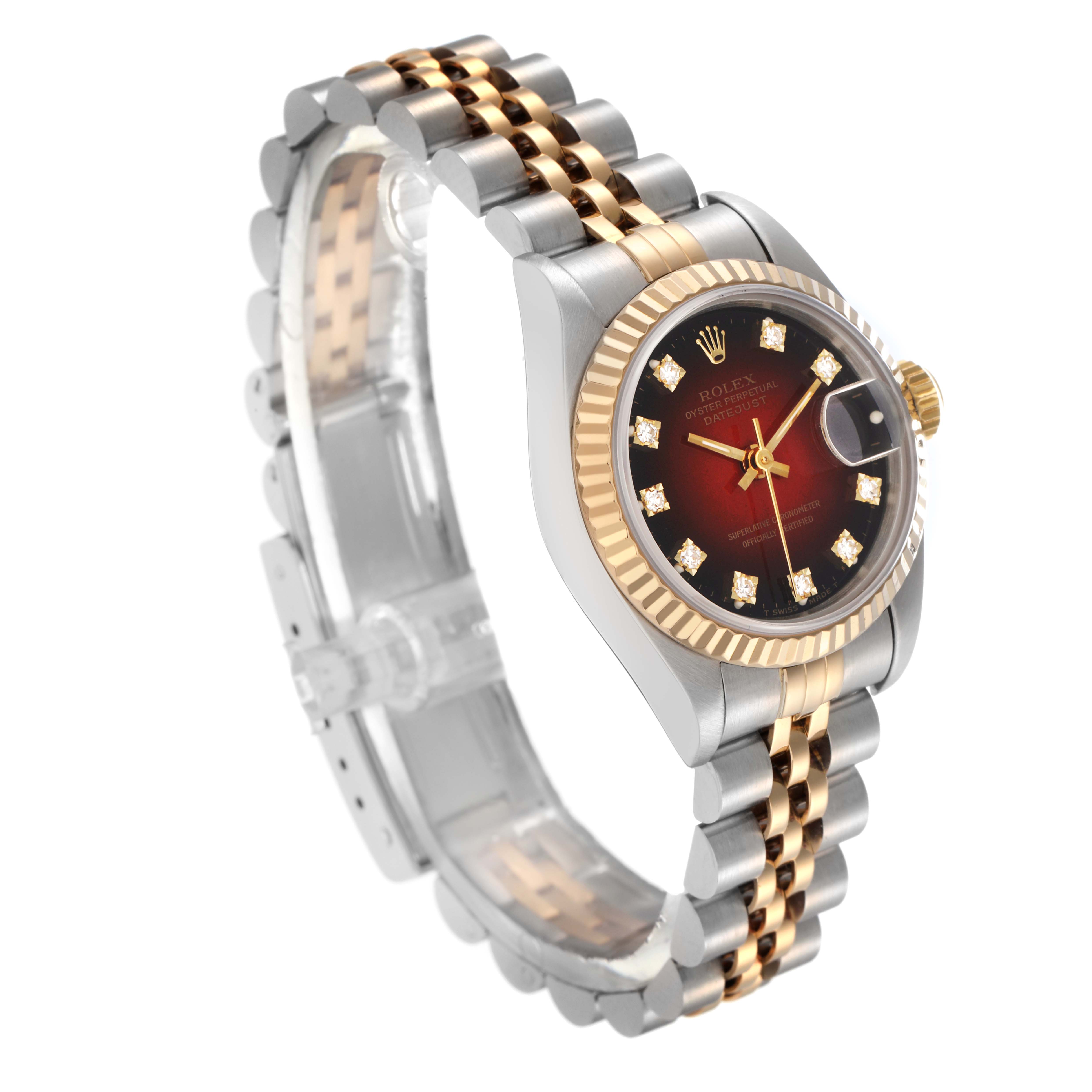 The Rolex Datejust 69173 Women
s Steel and Gold (two tone) Red Dial 69173 Women
s Steel and Gold (two tone) Red Dial watch is shown at a tilted angle, highlighting its face, bezel, crown, and two-tone bracelet.