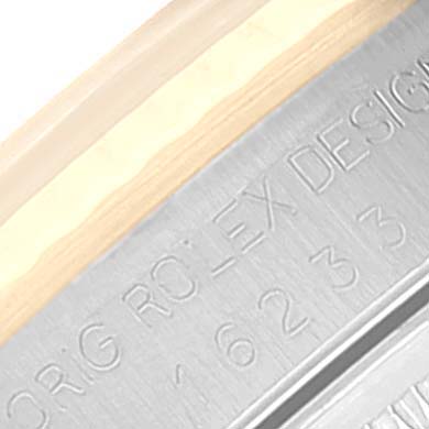 This image shows a close-up of the engraved serial number and text on the side of the case of a Datejust model by Rolex.