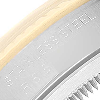 This close-up image shows the edge of a Rolex Datejust 16233 Men's Steel and Gold (two tone) White Dial 16233 Men's Steel and Gold (two tone) White Dial watch case with "STAINLESS STEEL" engraved on it.