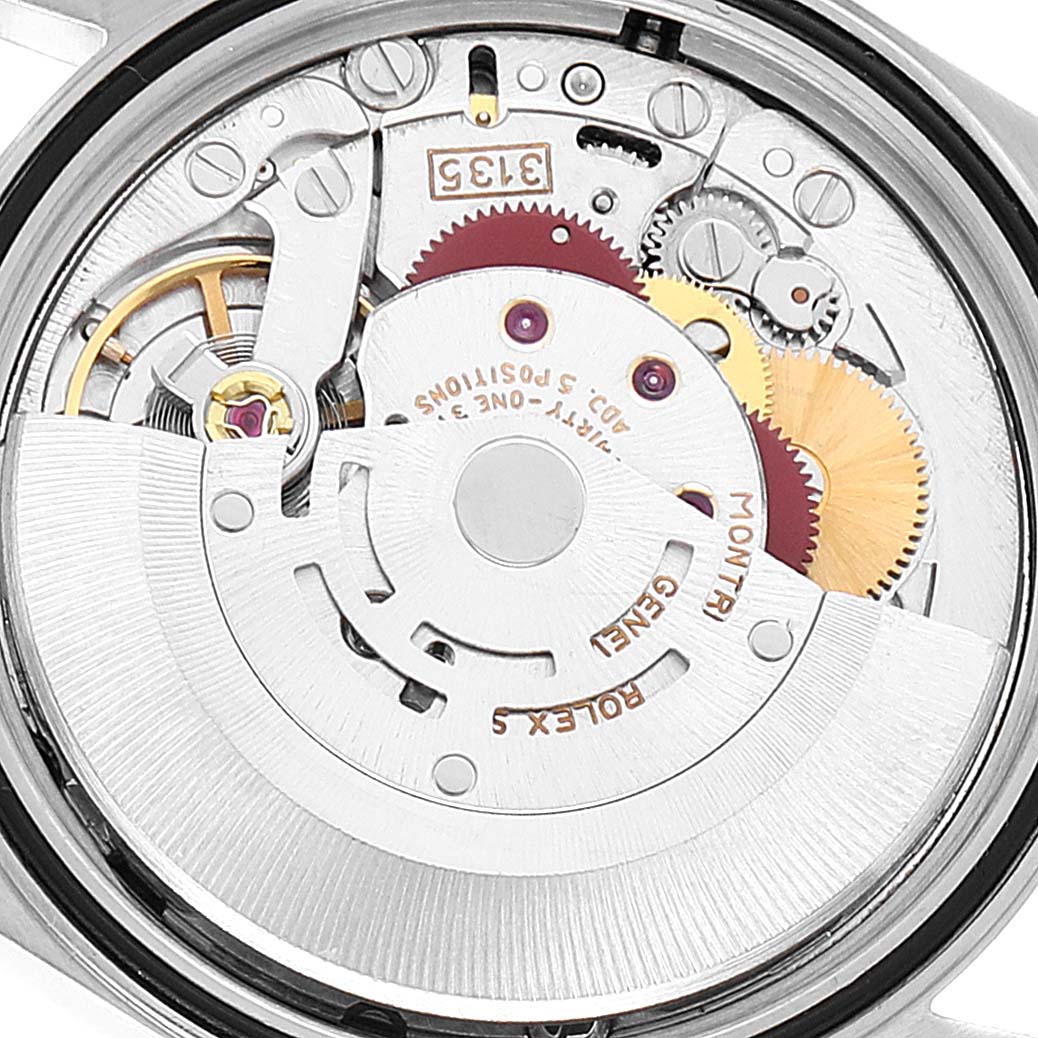 The image shows the inner mechanics and movement of the Rolex Datejust 16233 Men's Steel and Gold (two tone) White Dial 16233 Men's Steel and Gold (two tone) White Dial model watch from a rear angle.
