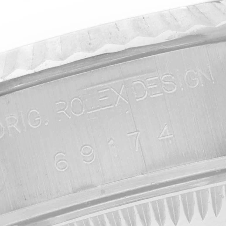 The image shows a close-up view of the side engraving on a Rolex Datejust 69174 Women
s Stainless Steel Silver Dial 69174 Women
s Stainless Steel Silver Dial, displaying the reference number.
