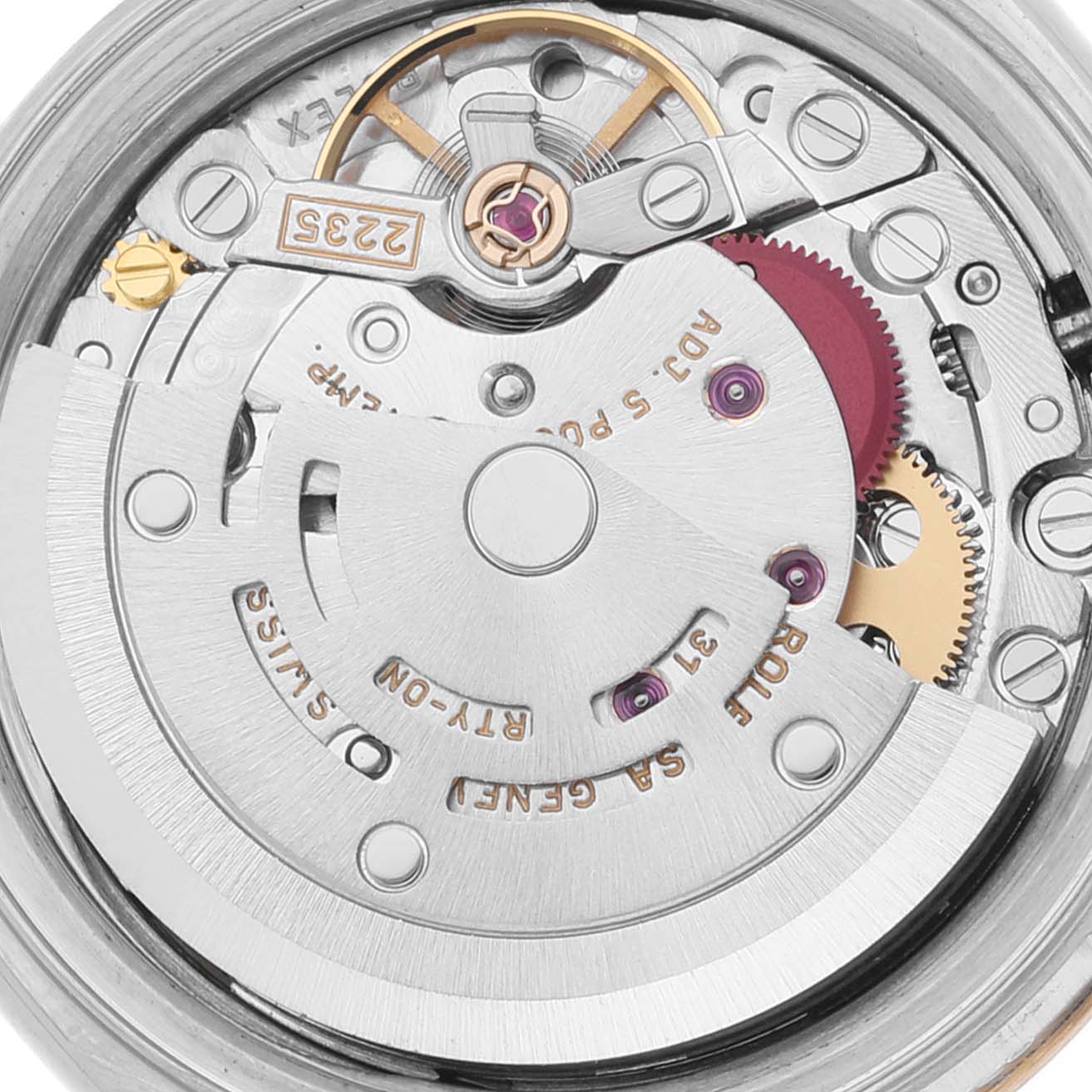 The image shows a close-up of the movement of a Rolex Datejust 79173 Women's Steel and Gold (two tone) Blue Dial 79173 Women's Steel and Gold (two tone) Blue Dial watch, highlighting its intricate mechanical parts.