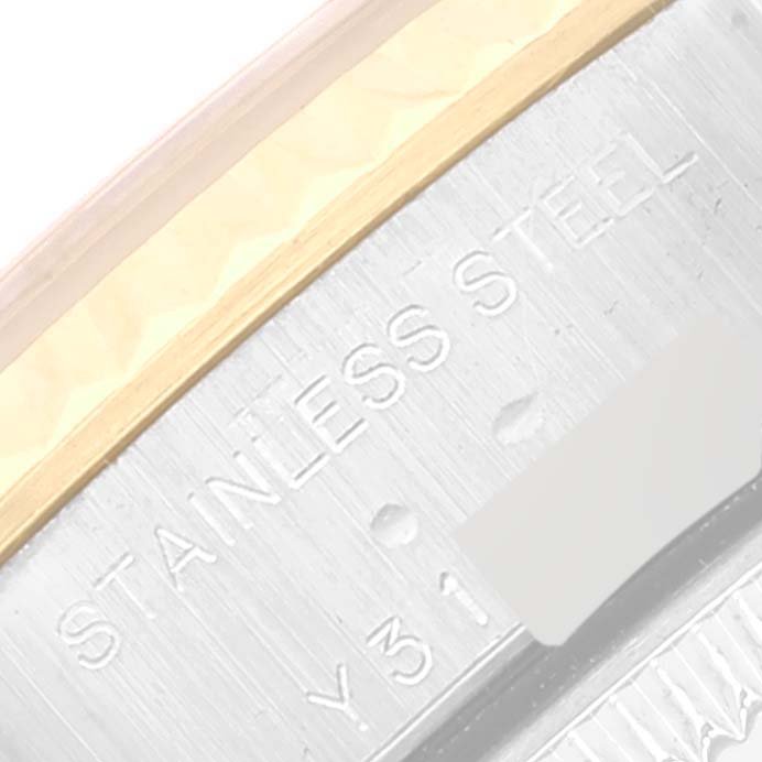 The image shows a close-up of the case side of a Rolex Datejust 79173 Women's Steel and Gold (two tone) Blue Dial 79173 Women's Steel and Gold (two tone) Blue Dial watch, focusing on the "STAINLESS STEEL" engraving.