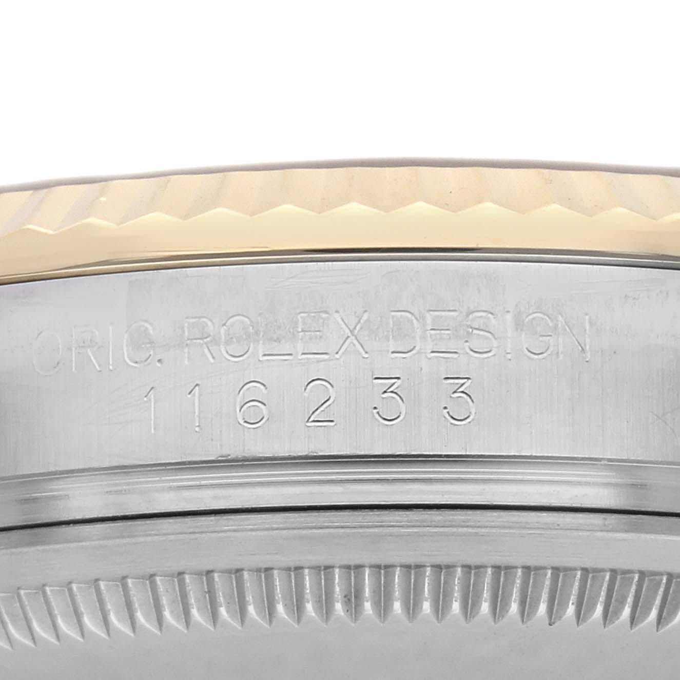 The image shows a close-up of the case side and engraved model number of a Rolex Datejust 116233 Men
s Steel and Gold (two tone) Champagne Dial 116233 Men
s Steel and Gold (two tone) Champagne Dial watch.