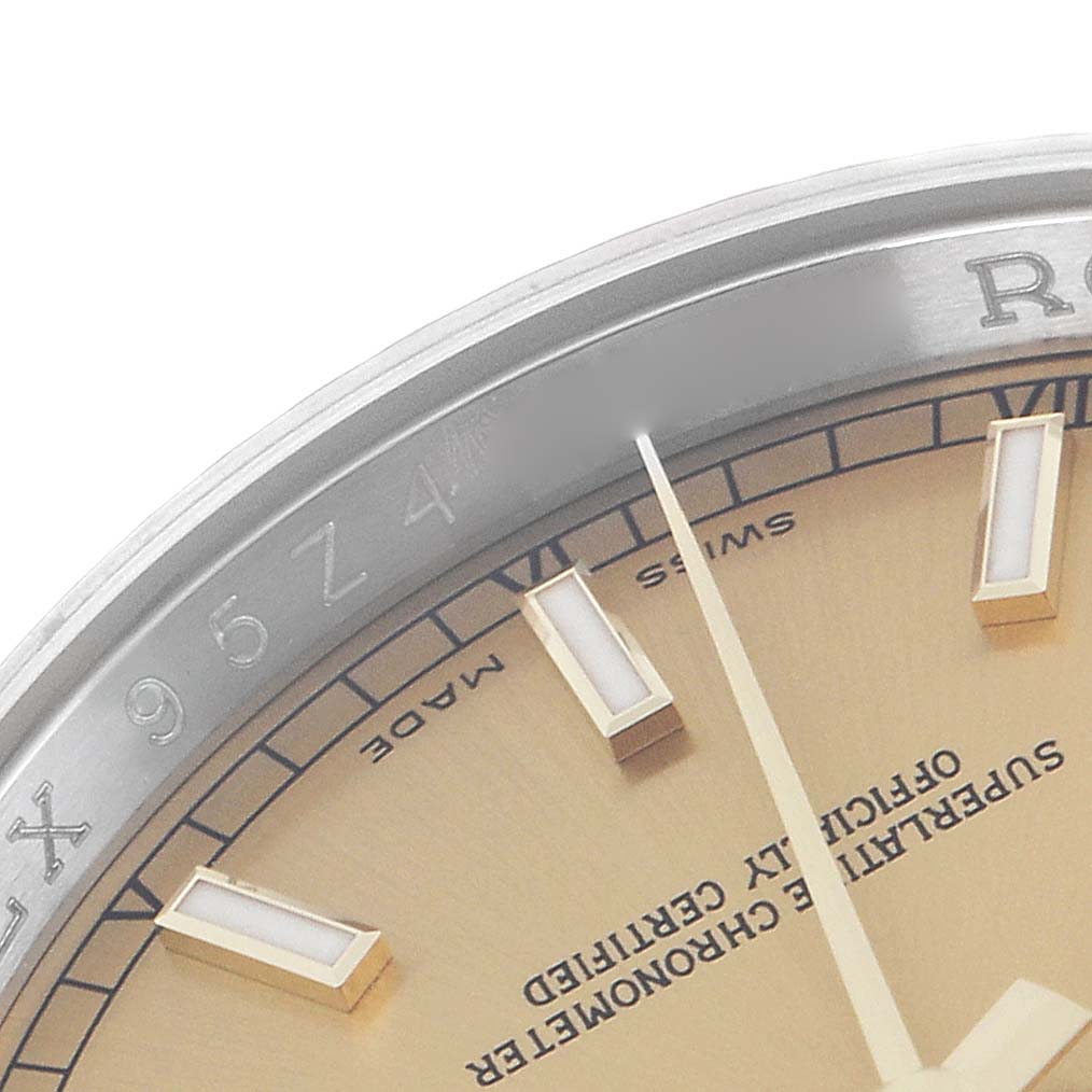 The image shows a close-up of the Rolex Datejust 116233 Men
s Steel and Gold (two tone) Champagne Dial 116233 Men
s Steel and Gold (two tone) Champagne Dial dial and bezel, highlighting the indices and text detailing.