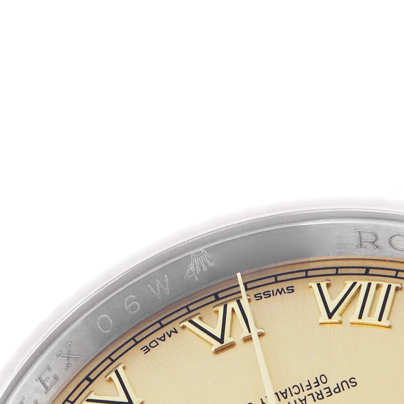 The image shows a close-up of the bezel and part of the dial of a Rolex Datejust 116233 Men
s Steel and Gold (two tone) Champagne Dial 116233 Men
s Steel and Gold (two tone) Champagne Dial, highlighting the Roman numerals and branding.