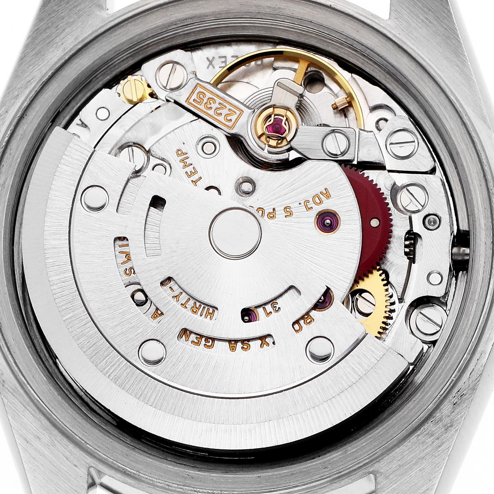 The image shows a close-up of the Rolex Datejust 79173 Women
s Steel and Gold (two tone) Mother of Pearl Dial 79173 Women
s Steel and Gold (two tone) Mother of Pearl Dial
s movement, highlighting gears and components from a top-down angle.