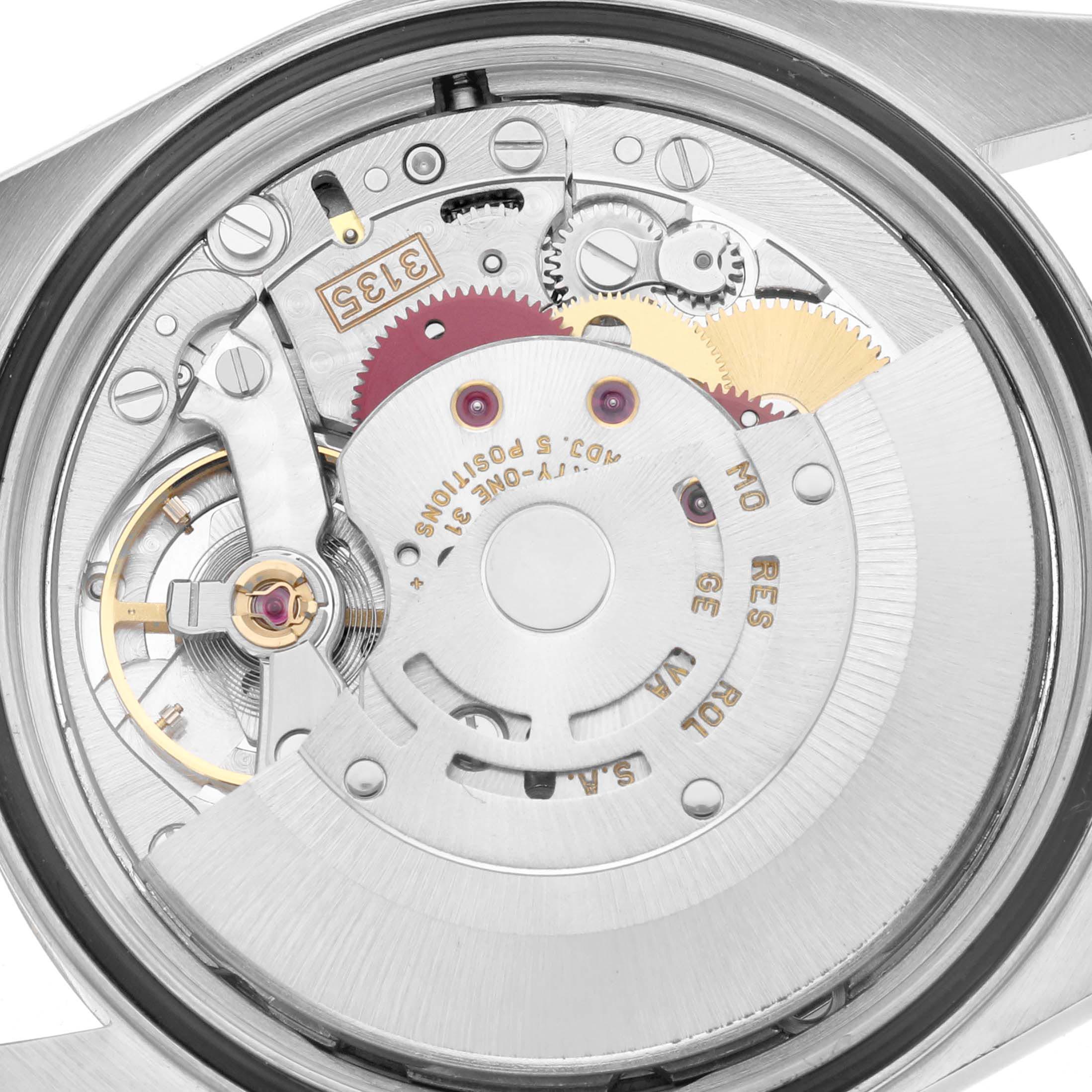 The image shows the movement from the back of a Rolex Datejust 16203 Men
s Steel and Gold (two tone) Grey Dial 16203 Men
s Steel and Gold (two tone) Grey Dial, highlighting the automatic rotor and gears.
