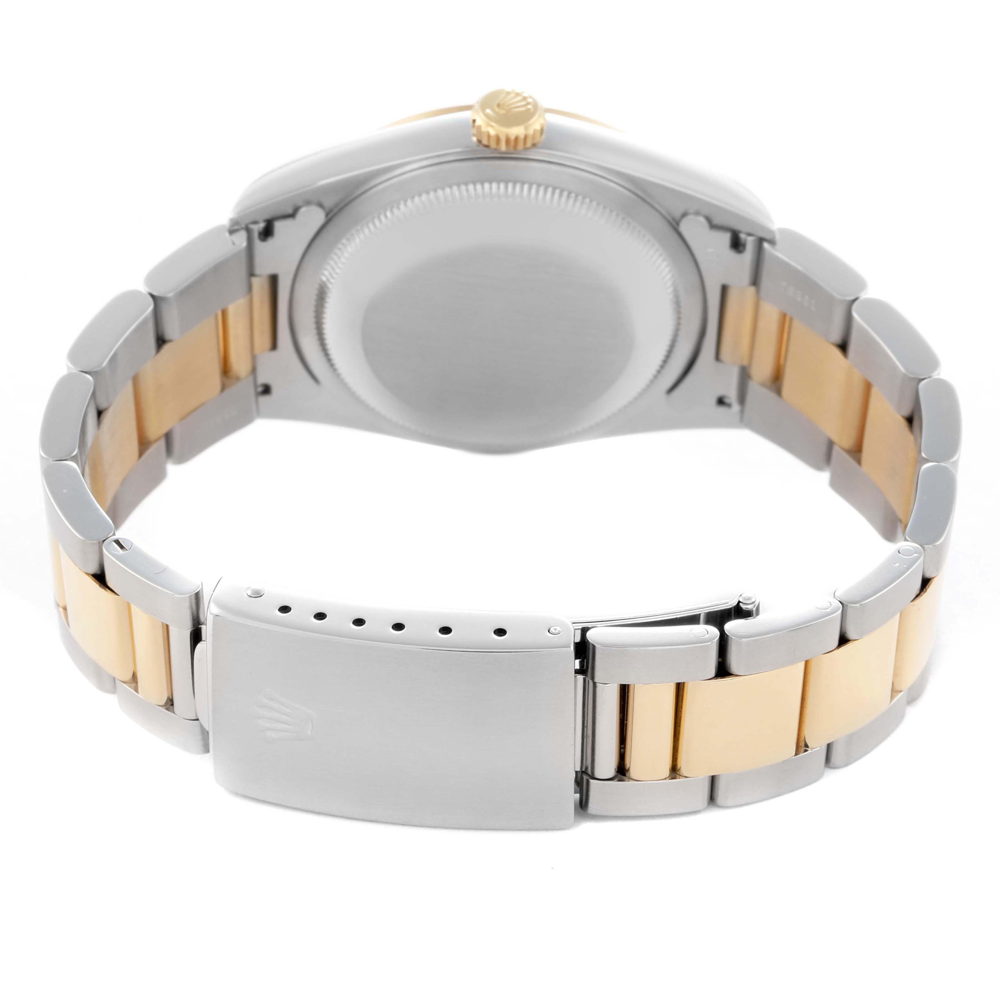 The image shows a Rolex Datejust 16203 Men
s Steel and Gold (two tone) Grey Dial 16203 Men
s Steel and Gold (two tone) Grey Dial watch from the back, highlighting the case back, crown, and two-tone bracelet with the clasp.