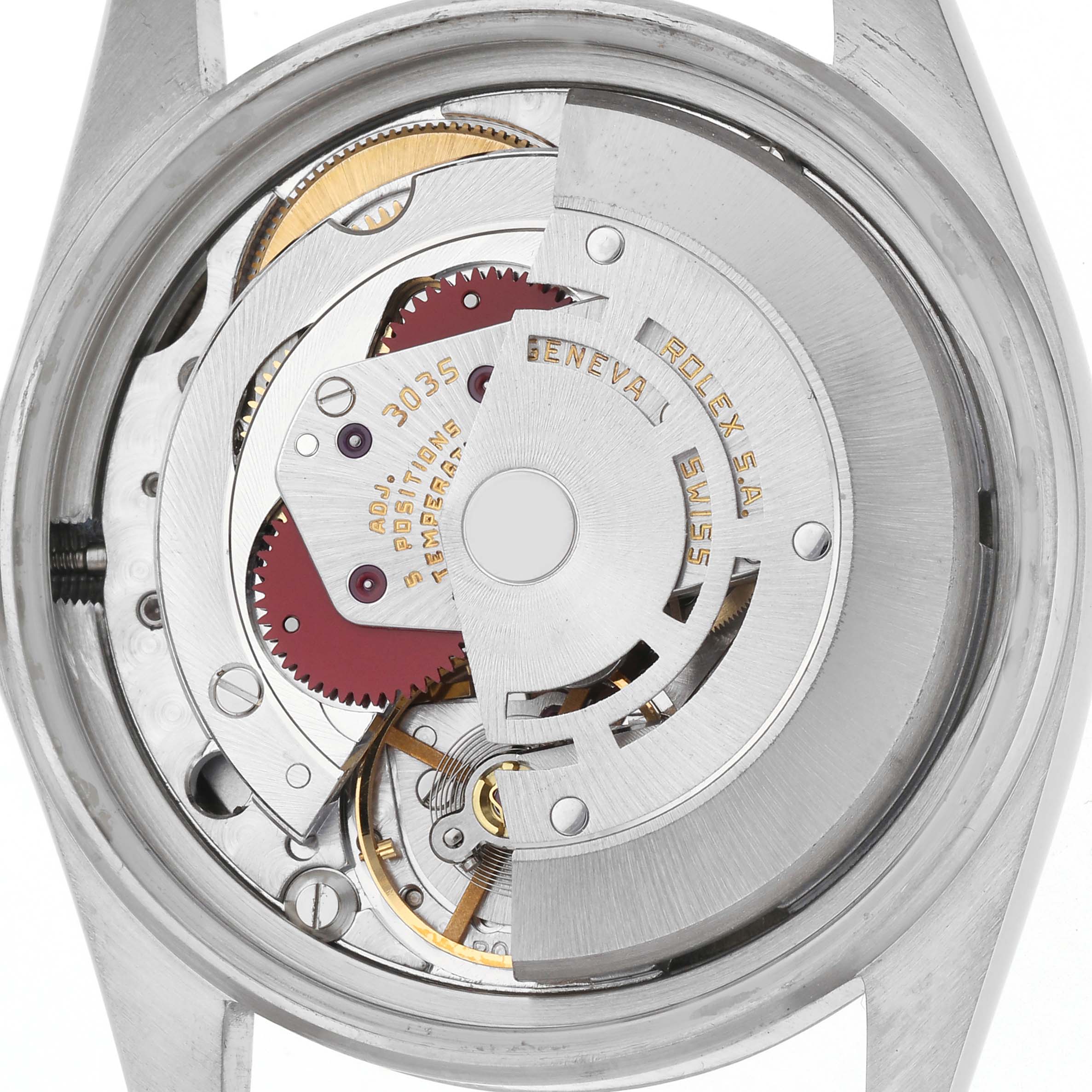 The image shows the back view of the Rolex Datejust 16013 Men
s Steel and Gold (two tone) Champagne Dial 16013 Men
s Steel and Gold (two tone) Champagne Dial watch, highlighting its intricate movement mechanism.